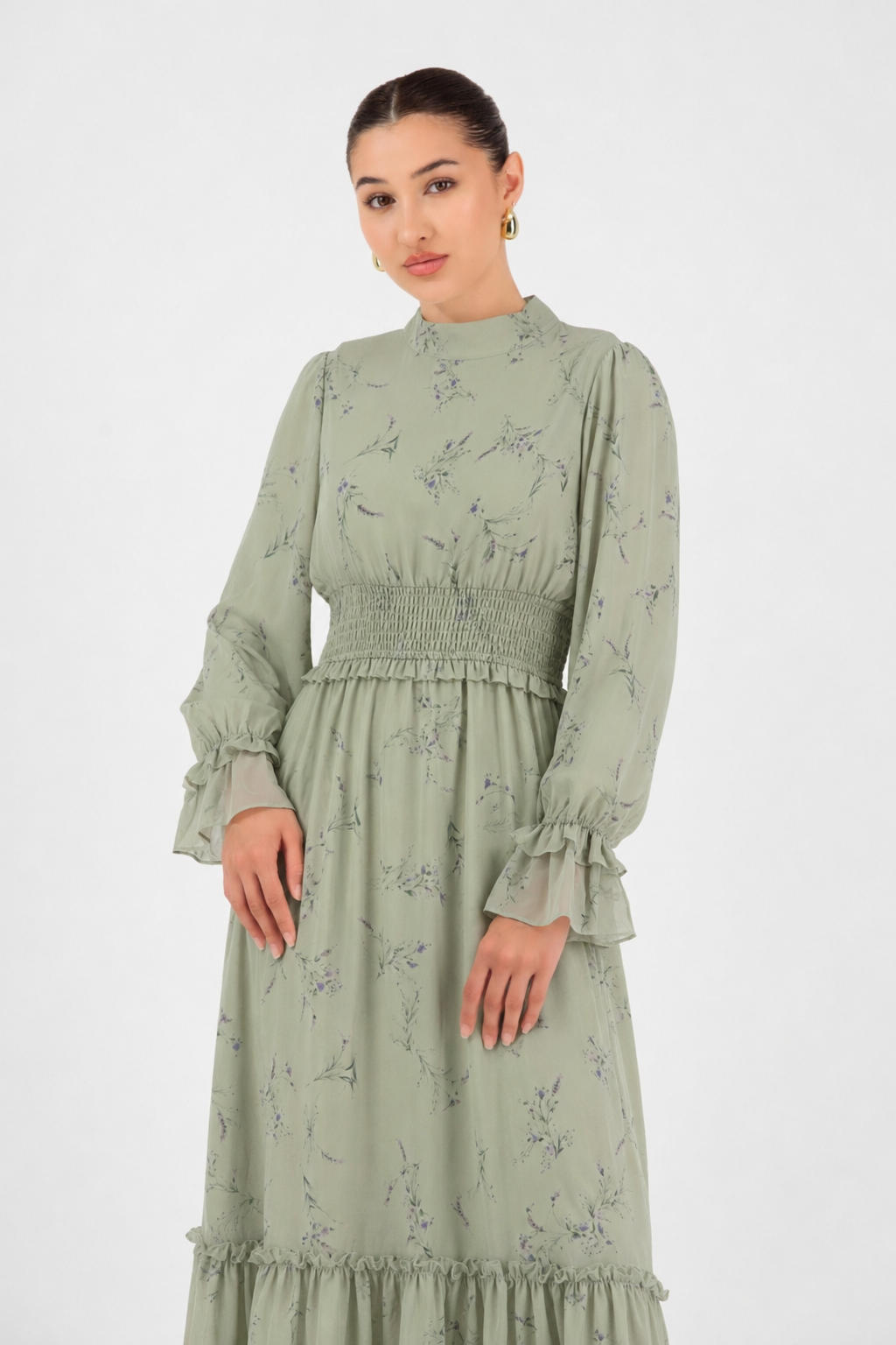 Close-up of the floral print and shirred waist detail on the Sage Meadow maxi dress.