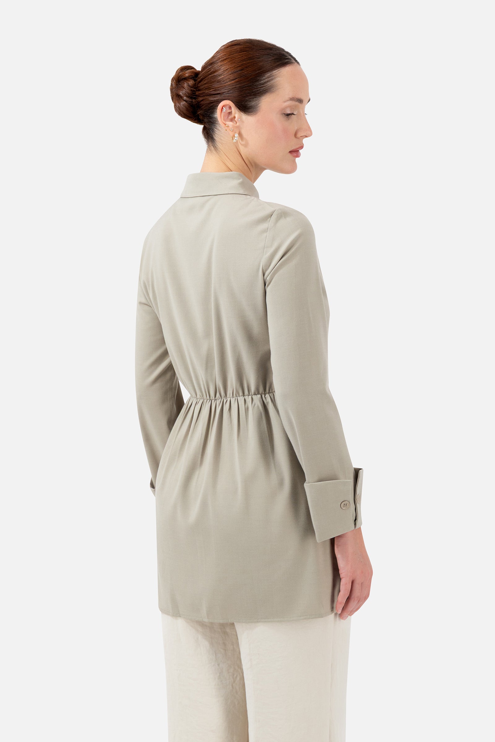 Back view of the Antique Green button-up shirt showcasing the tailored fit and longline design.