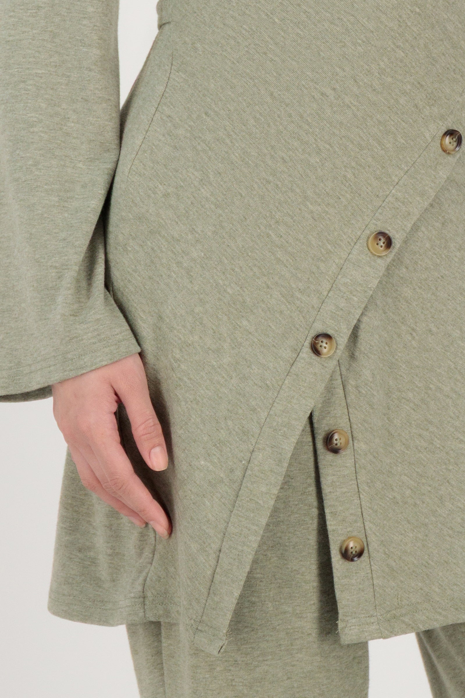 Close-up detail of the FARES Button Detail Knit Tunic in Olive focusing on the button detailing and knit texture that define this tunic.