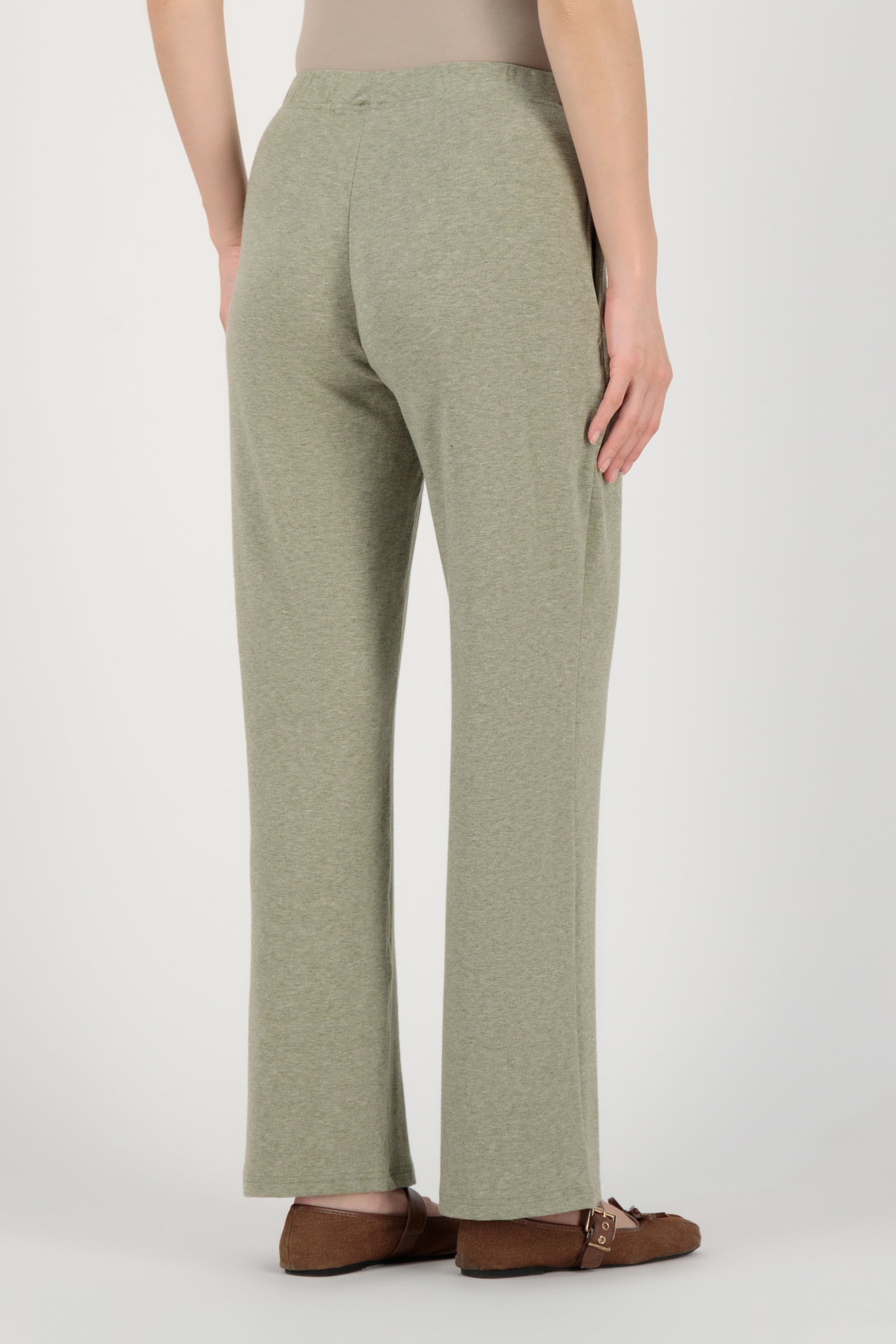 Back view of the FARES Straight Leg Knit Pants in Olive highlighting the relaxed structure and smooth fall of these knit pants.