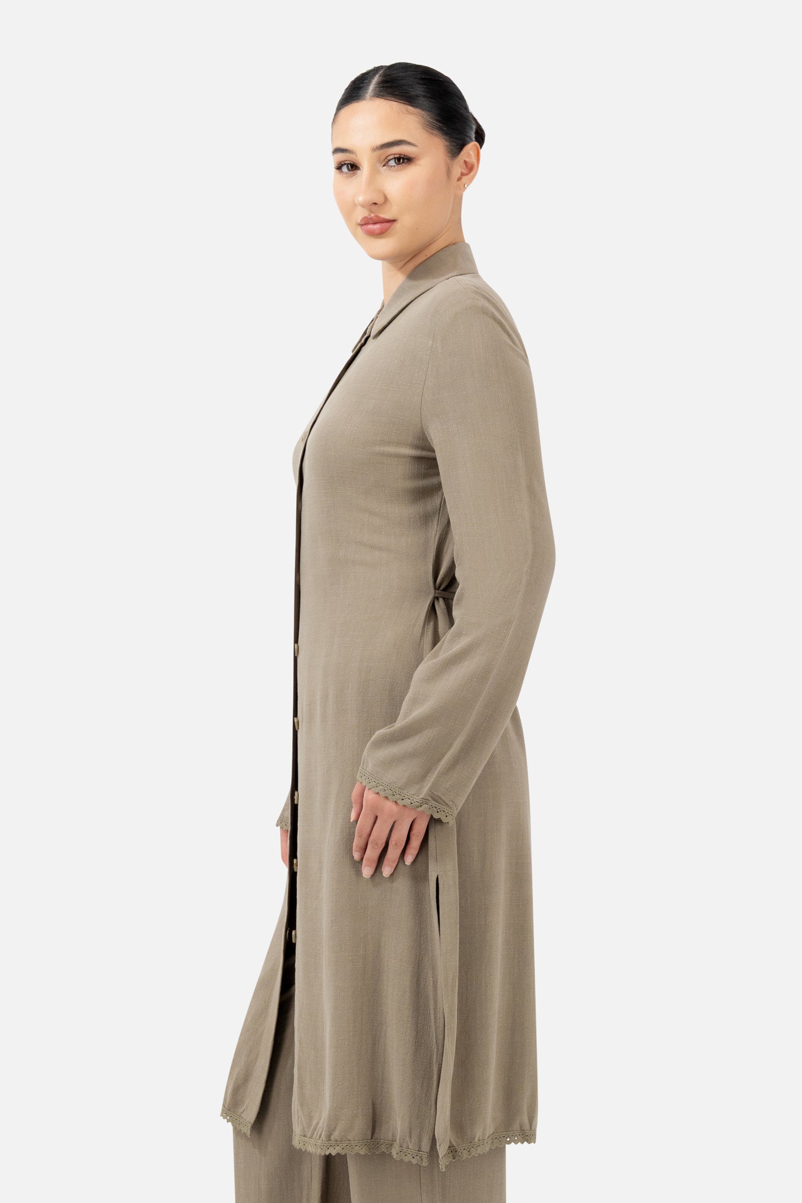 Side profile of the Haze Lace Trim Longline Button-Up highlighting the flowing silhouette.