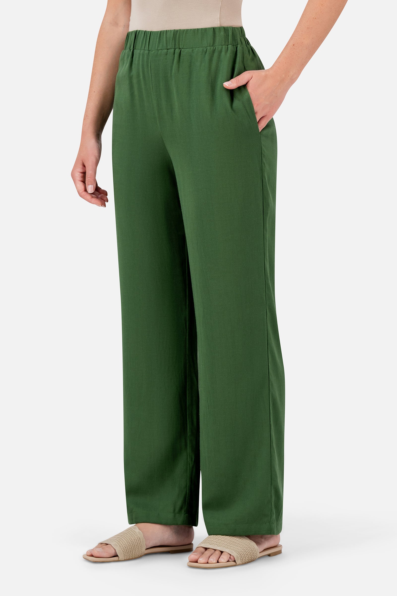 FARES Relaxed Fit Pants in Evergreen shown at an angle, highlighting the easy shape and relaxed fit of these pants for women.