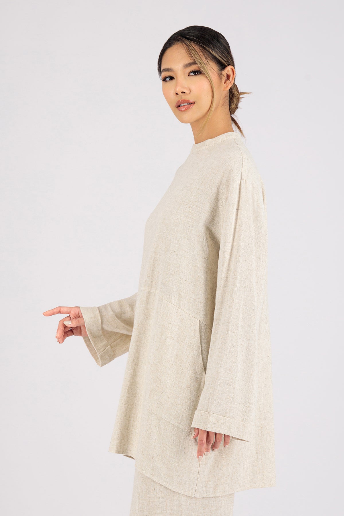 Colour: Vanilla. A girl turned left in a Linen Blend Top