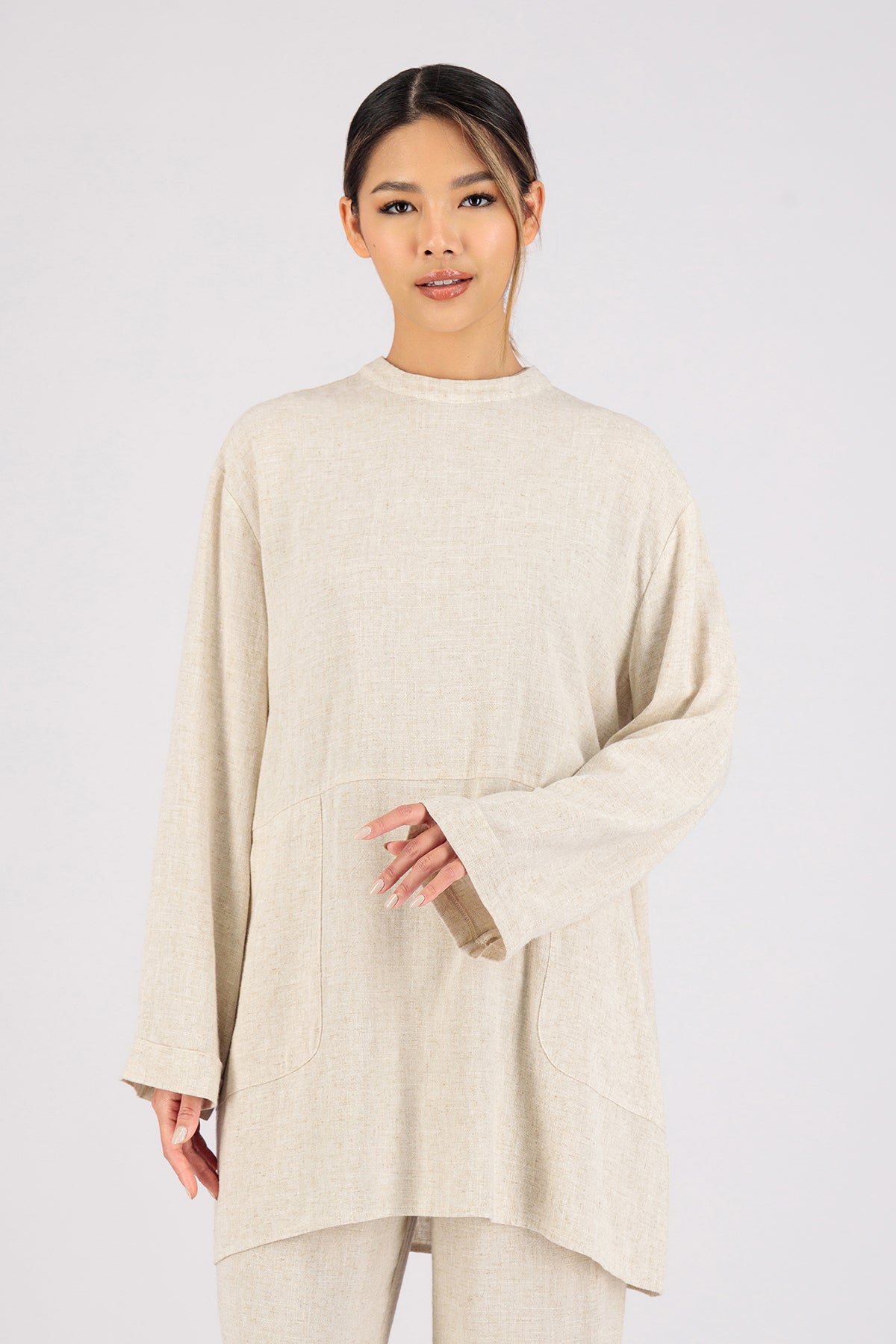 Colour: Vanilla. A close up of a girl wearing a Linen Blend Top.