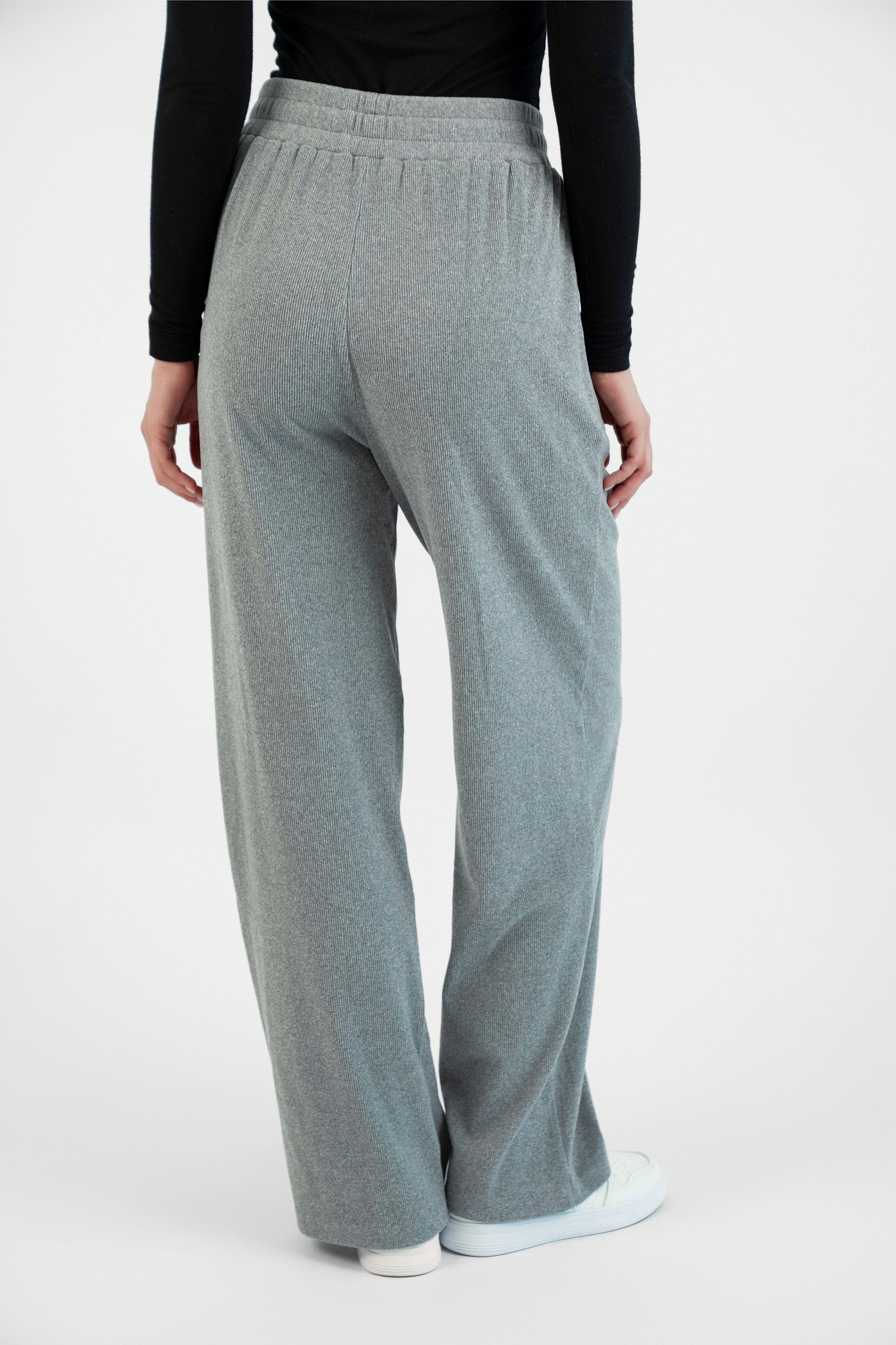 FARES' velour pants are shown fromthe back. Colour description: Heather Grey.