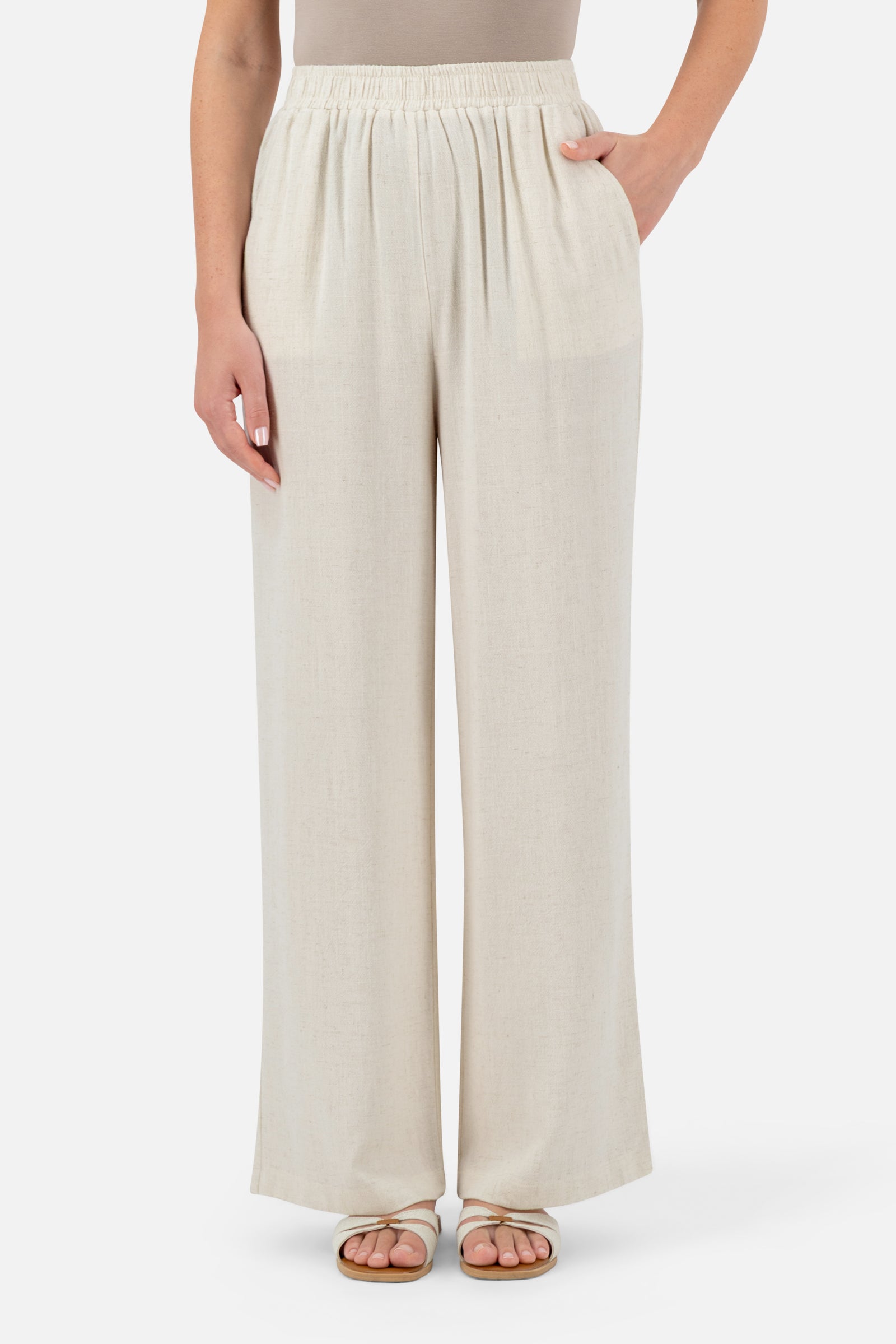 Woman wearing the Vanilla linen blend pants, front view with a relaxed wide-leg silhouette.