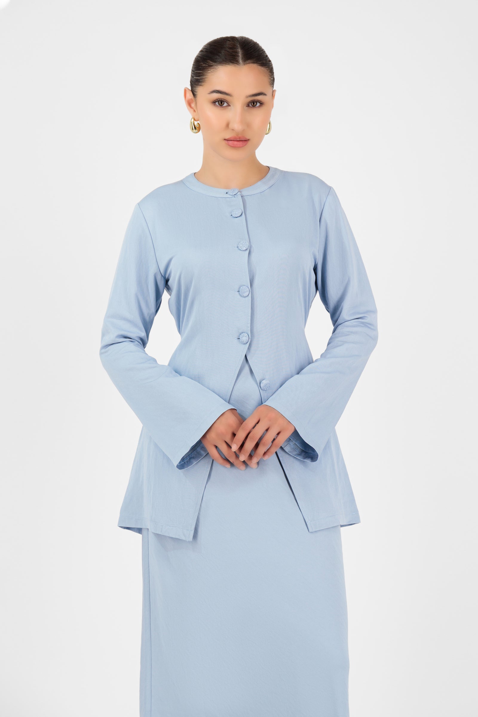 Close-up of the sleeve and hem construction on the FARES Tailored Vintage Lightweight Cardigan in Powder Blue, showcasing its refined finish for cardigan women.