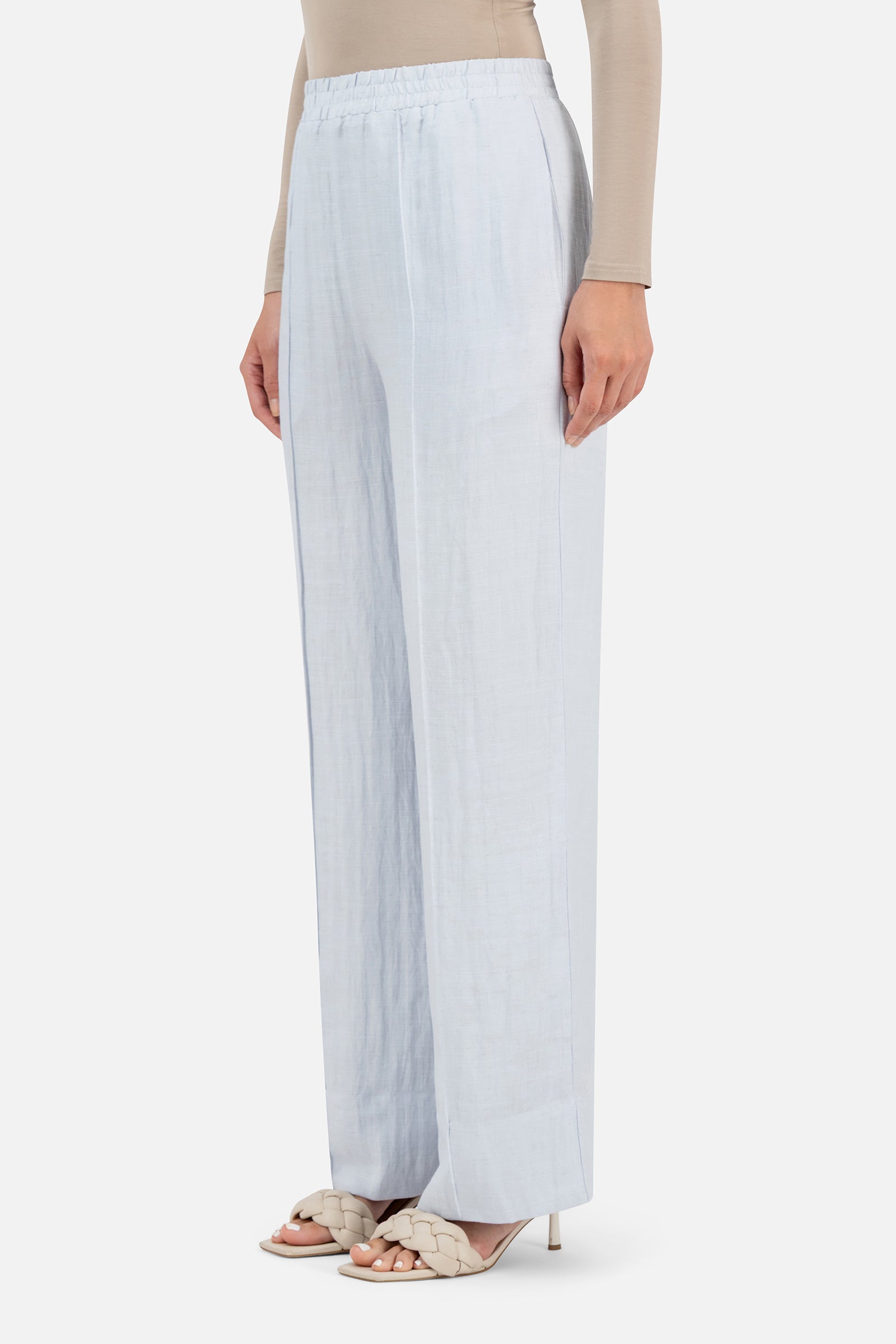 Side profile of the FARES Straight Leg Flowy Pants in Blueberry Cream highlighting the elongated shape of the straight leg pants.