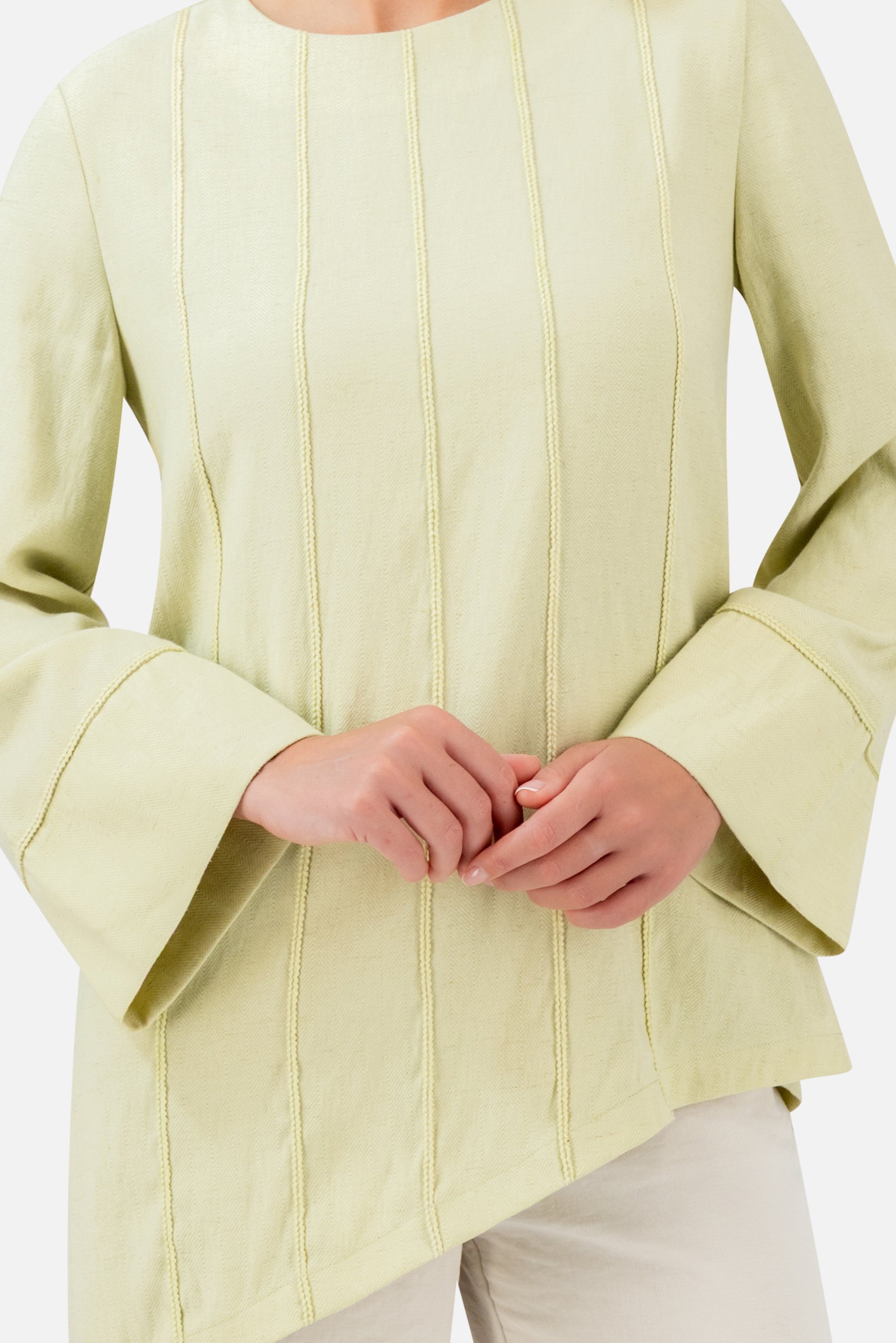 Closer view of the FARES Braid Detail Slanted Tunic in Honeydew, showing the delicate vertical braid detailing and softly textured fabric.
