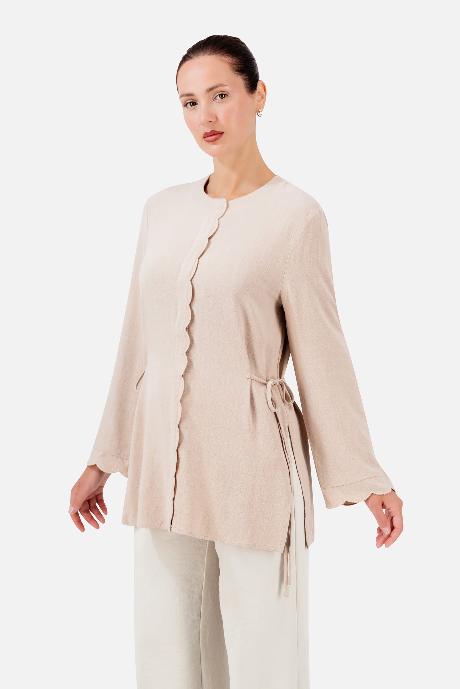 FARES Scalloped Detail Linen Blend Top in Shell, a feminine linen top with delicate scalloped edges and adjustable side ties.