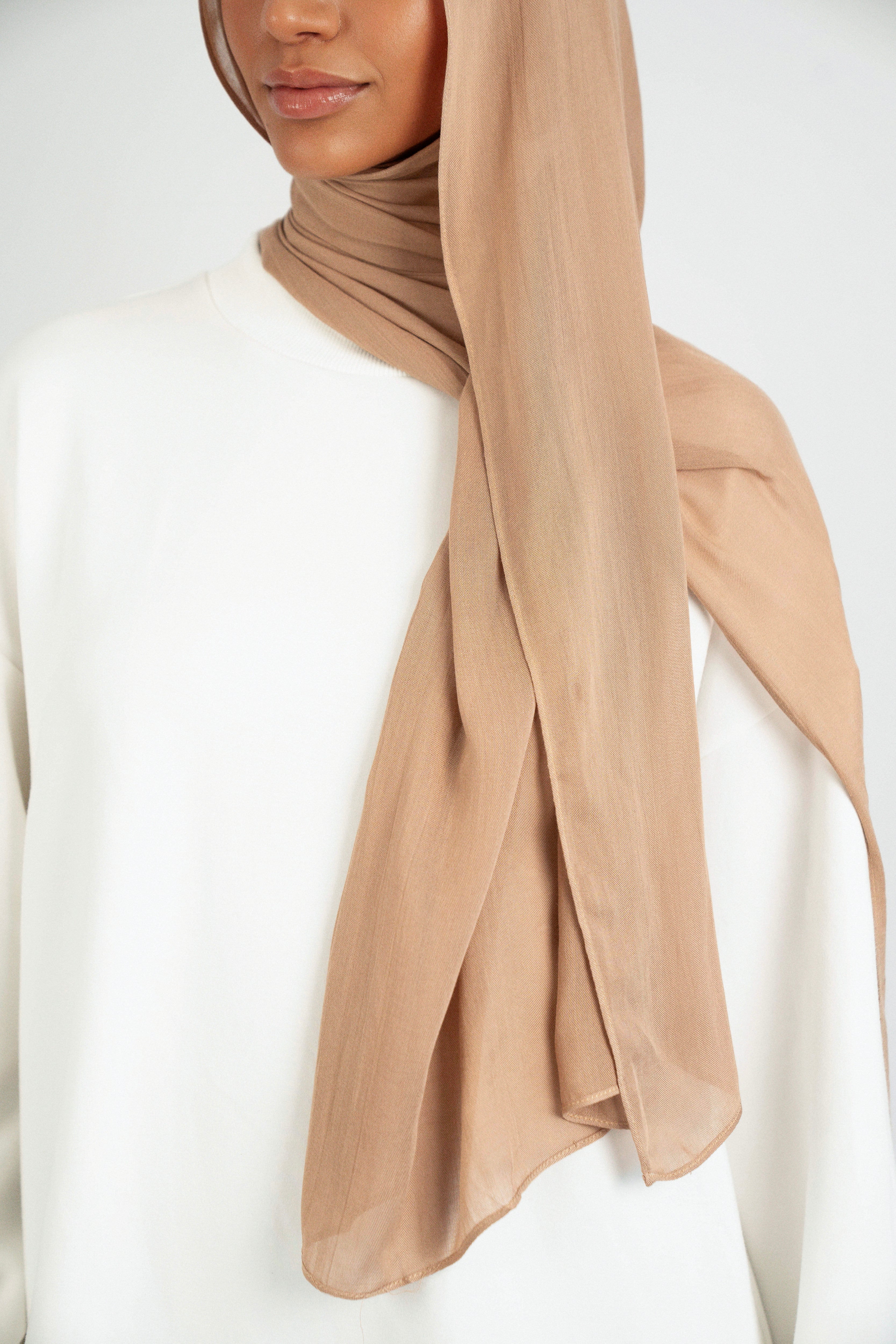 A close up of the Matching Butter Modal Hijab Set fitting on the shoulder of a model. Colour: Almond