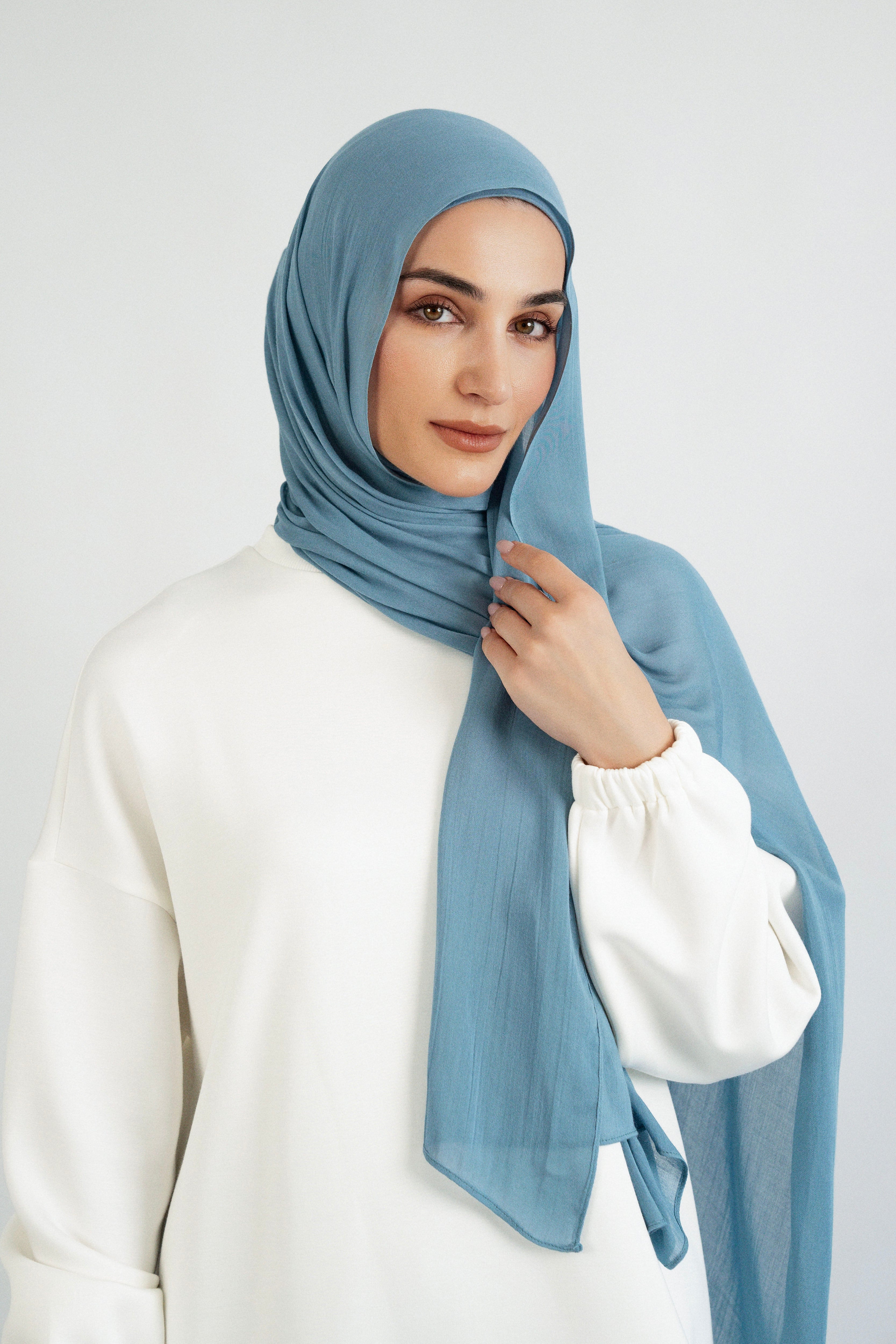 Colour: Marina. A front pose from a model in a Matching Butter Modal Hijab Set