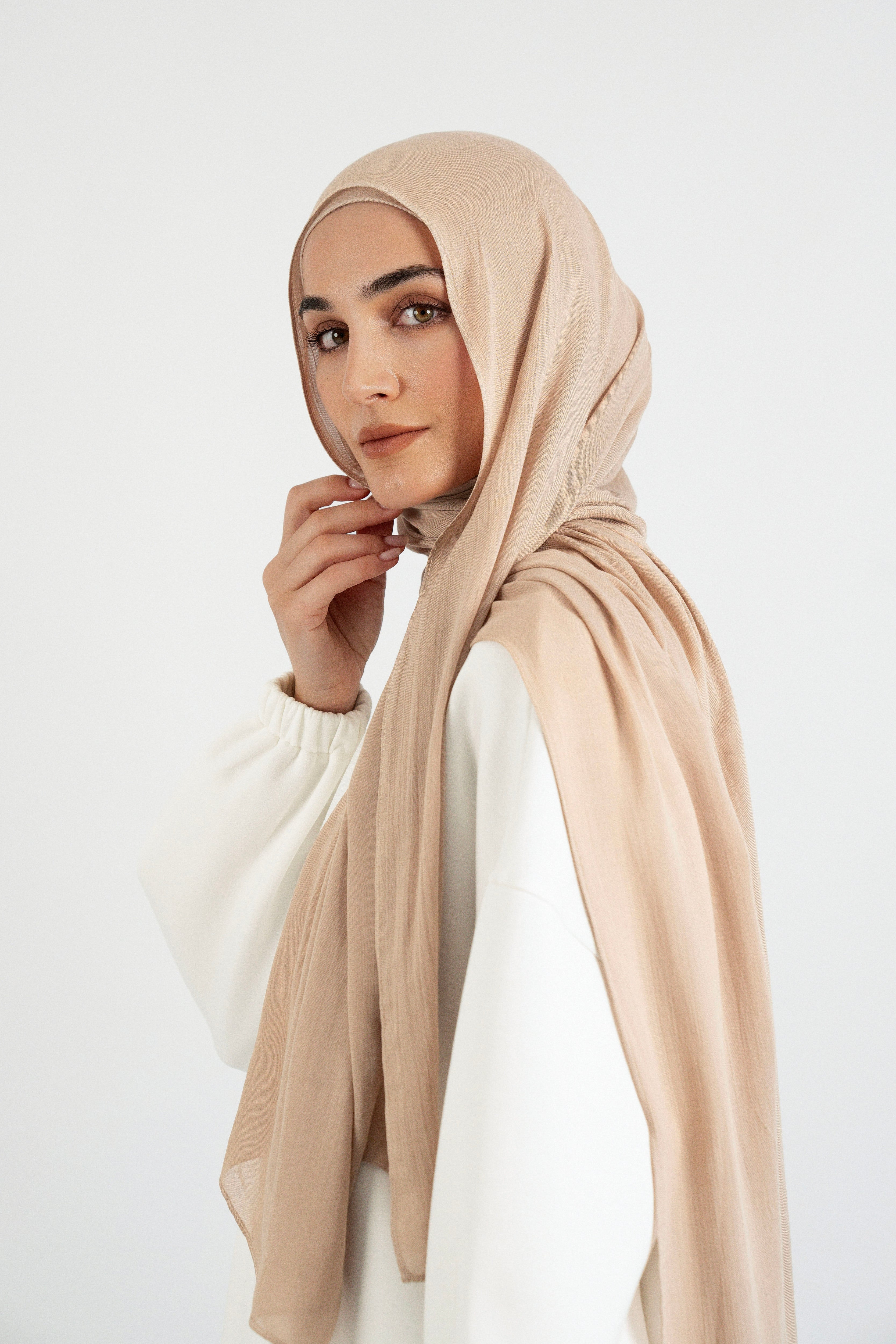 Colour: Biscuit. A side pose from a model in a Matching Butter Modal Hijab Set.
