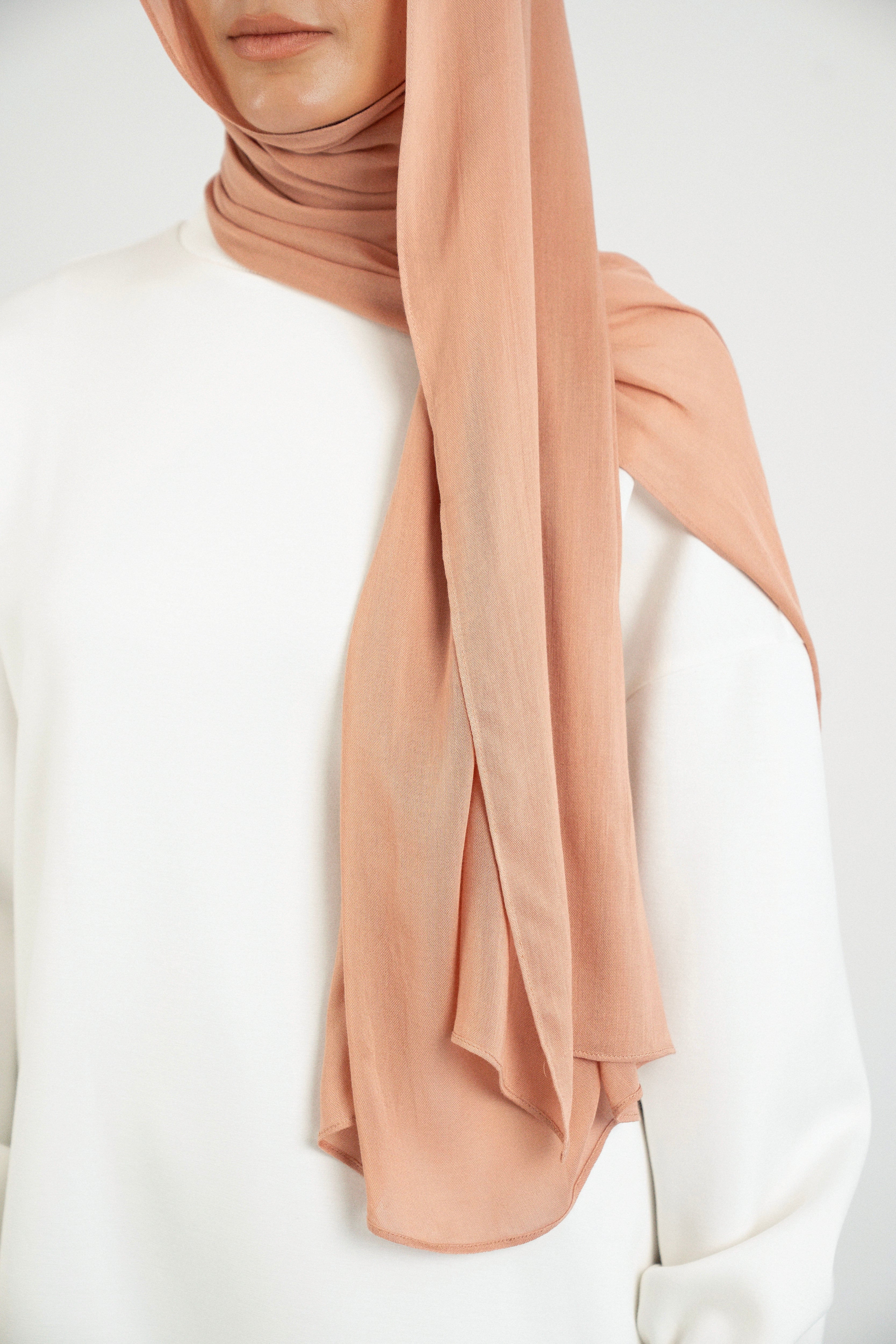 Colour: Clay.  A shoulder view of a Matching Butter Modal Hijab Set.