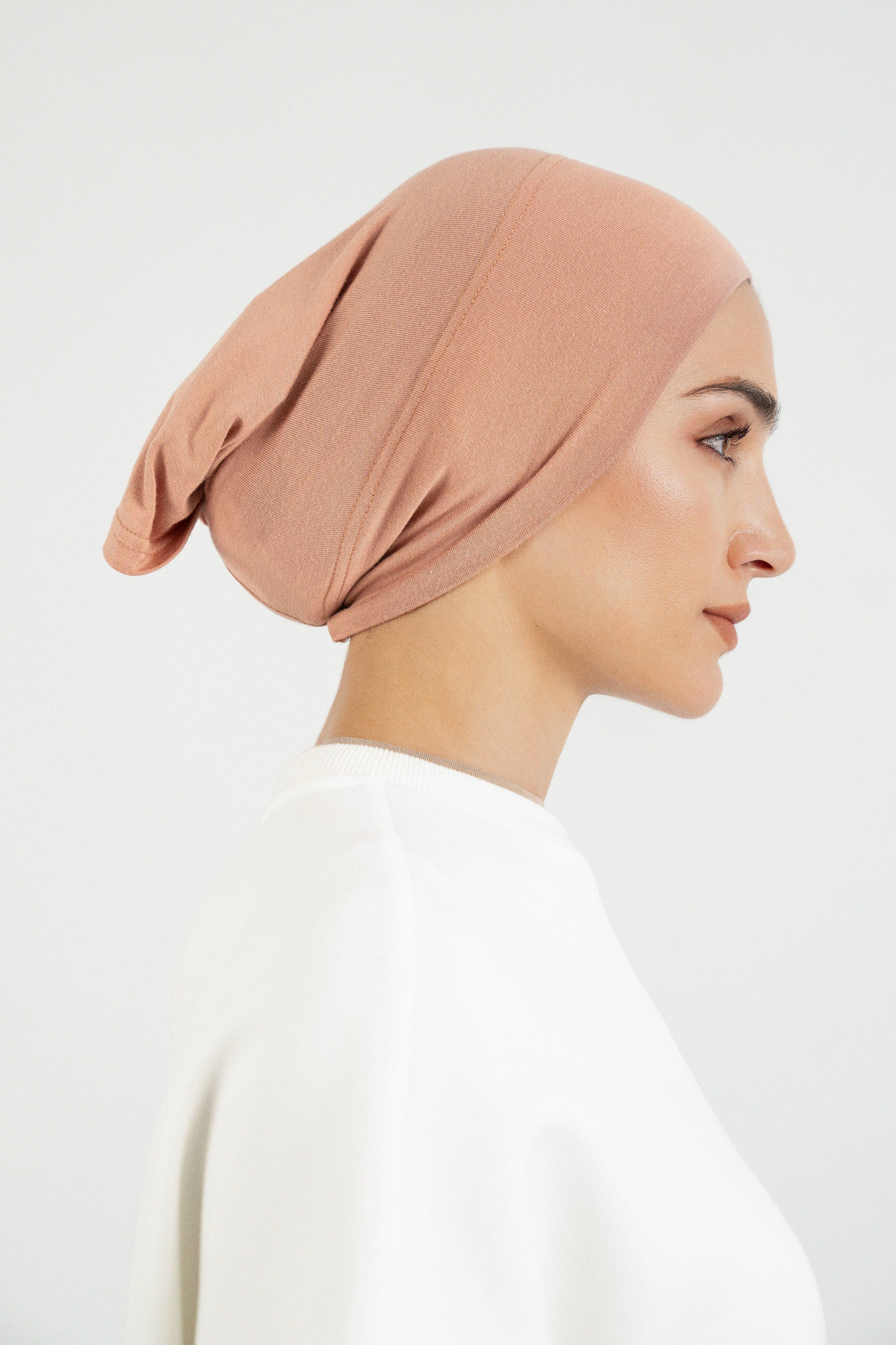 Colour: Clay. The right profile of a girl wearing a modal hijab undercap.