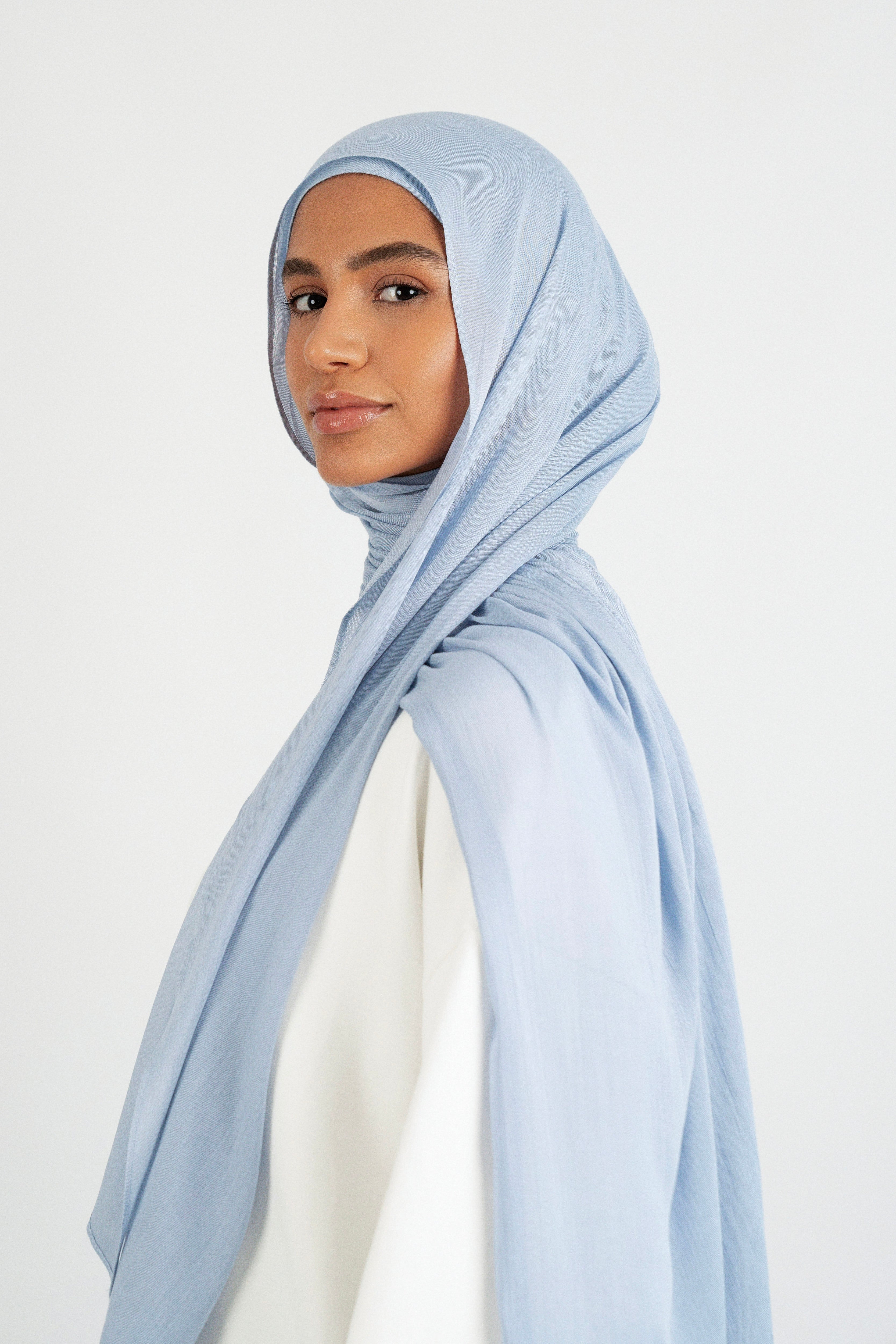 Colour: Mist. A model is turned left in a Matching Butter Modal Hijab Set.