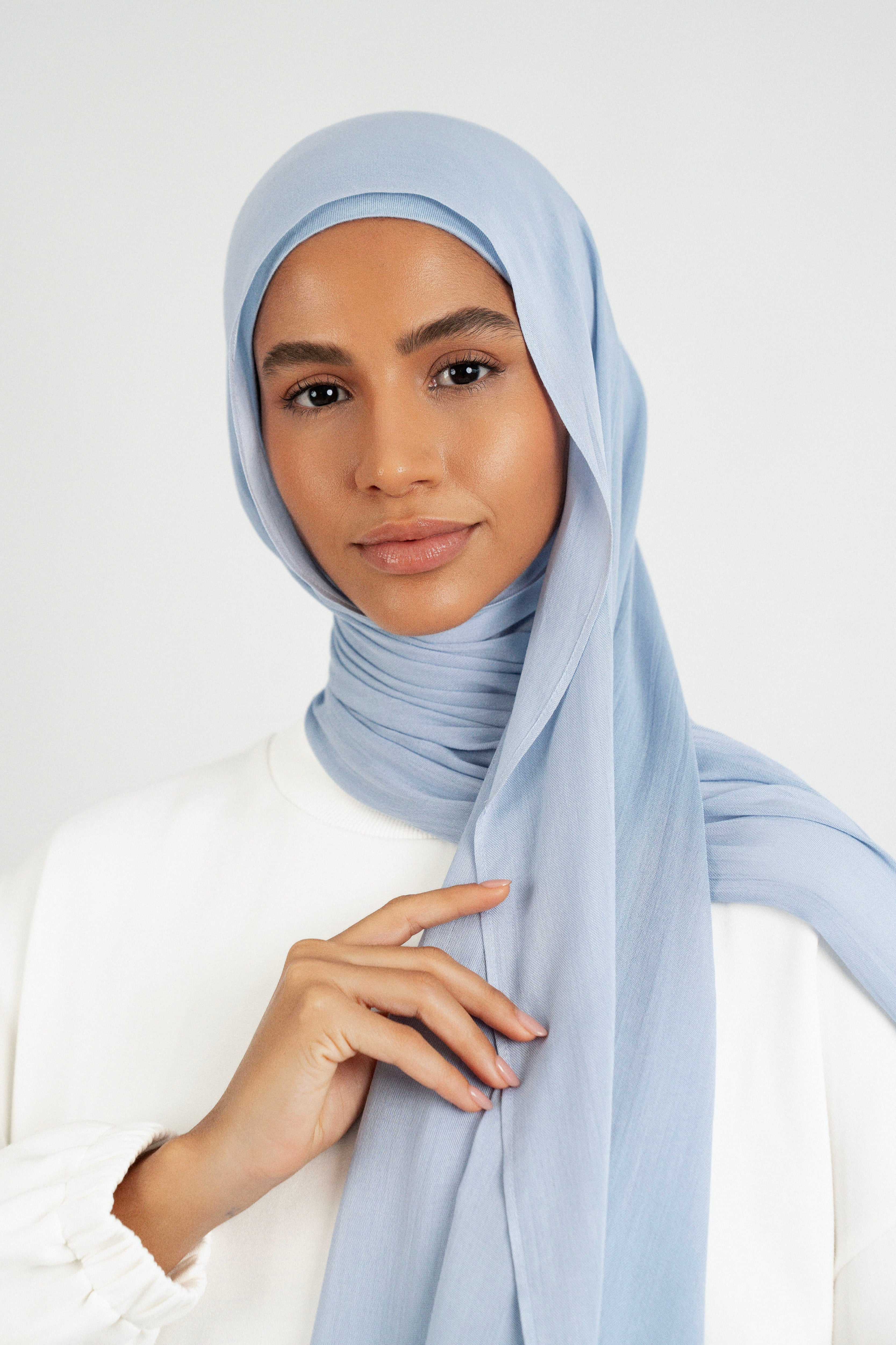 Colour: Mist. A close up of girl wearing a Matching Butter Modal Hijab Set