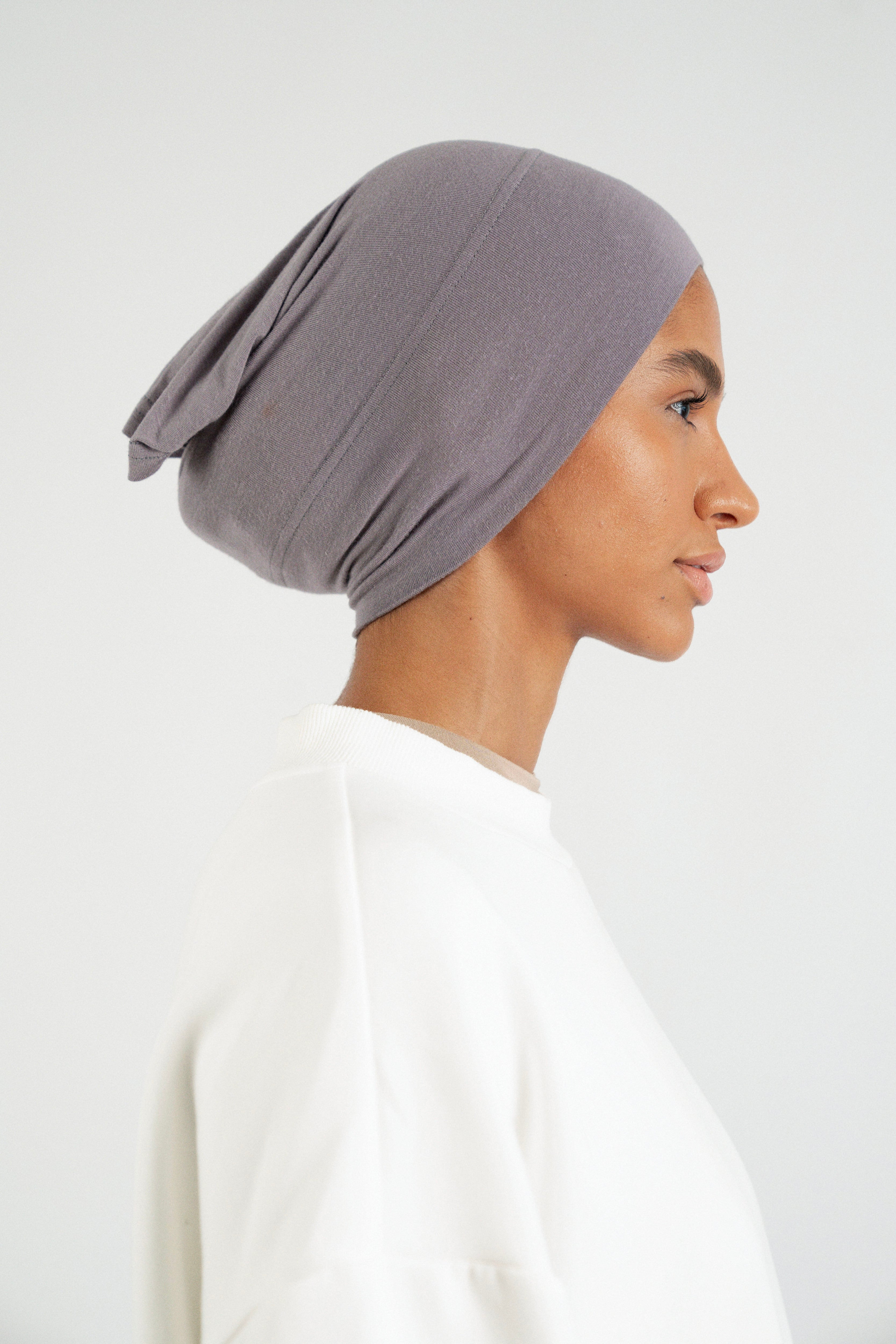 Colour: Moon. The right profile of a girl wearing a modal hijab undercap.