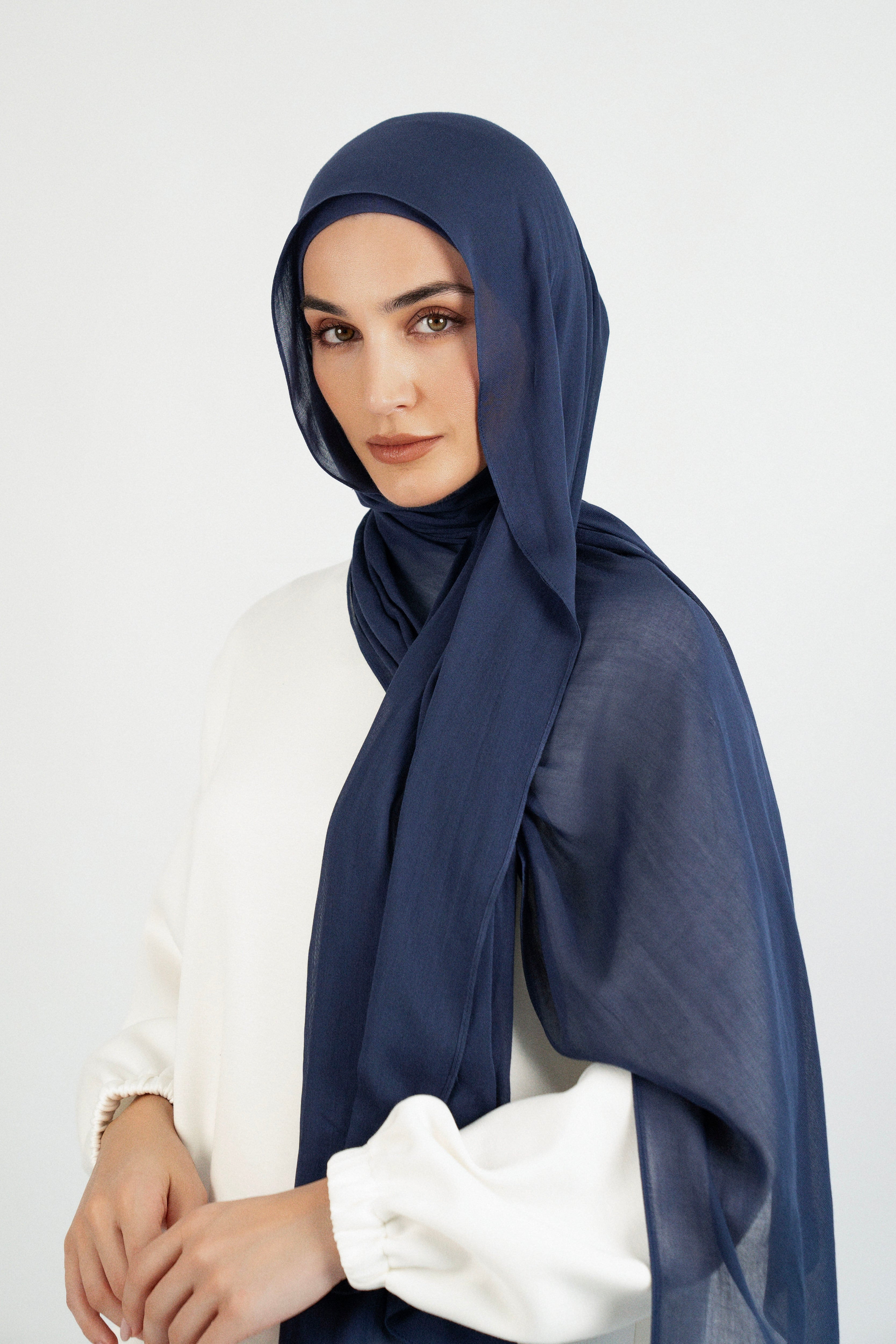 Colour: Navy. A side pose from a model in a Matching Butter Modal Hijab Set.