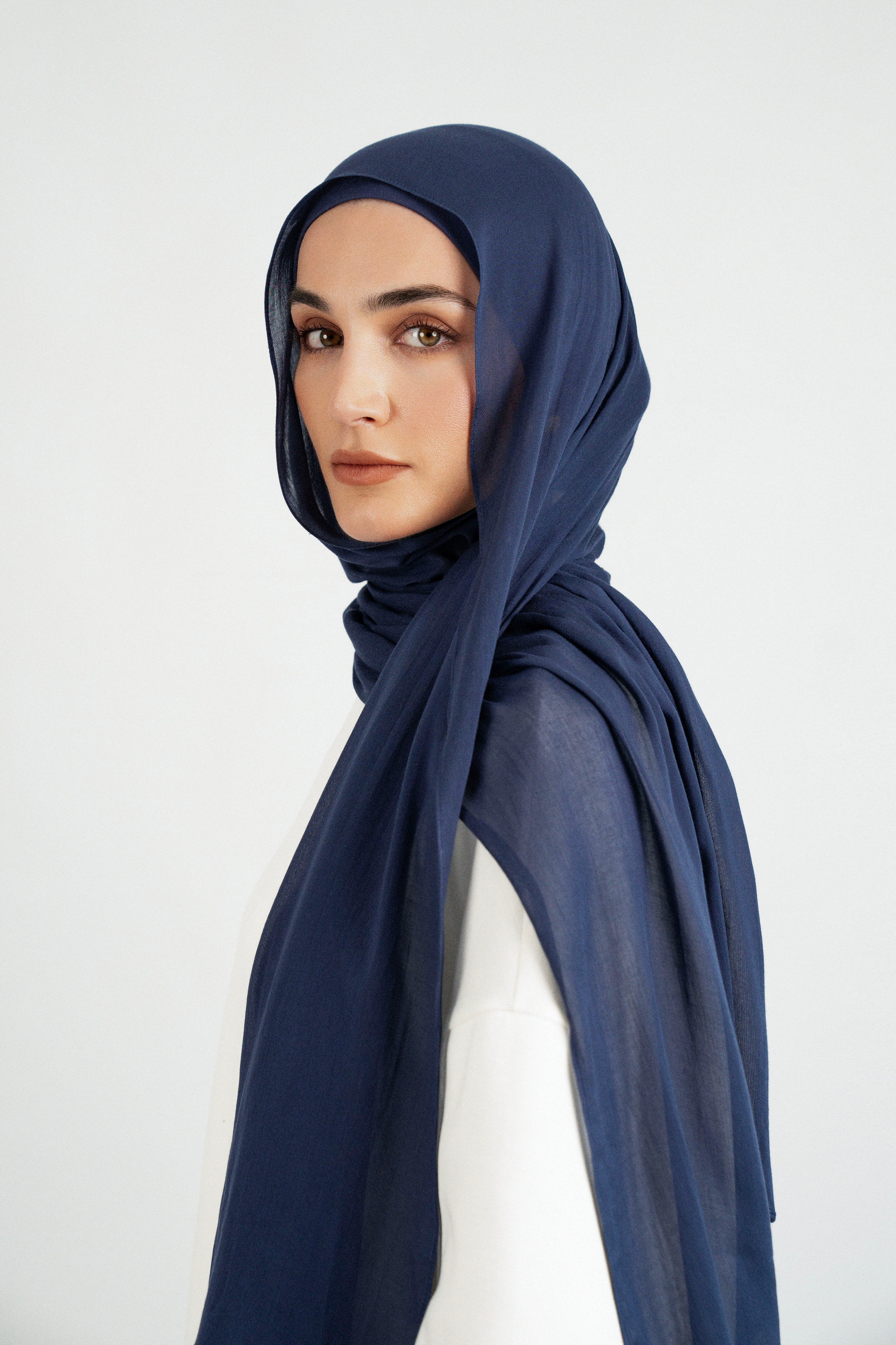 Colour: Navy. The girl is turned left in a Matching Butter Modal Hijab Set.