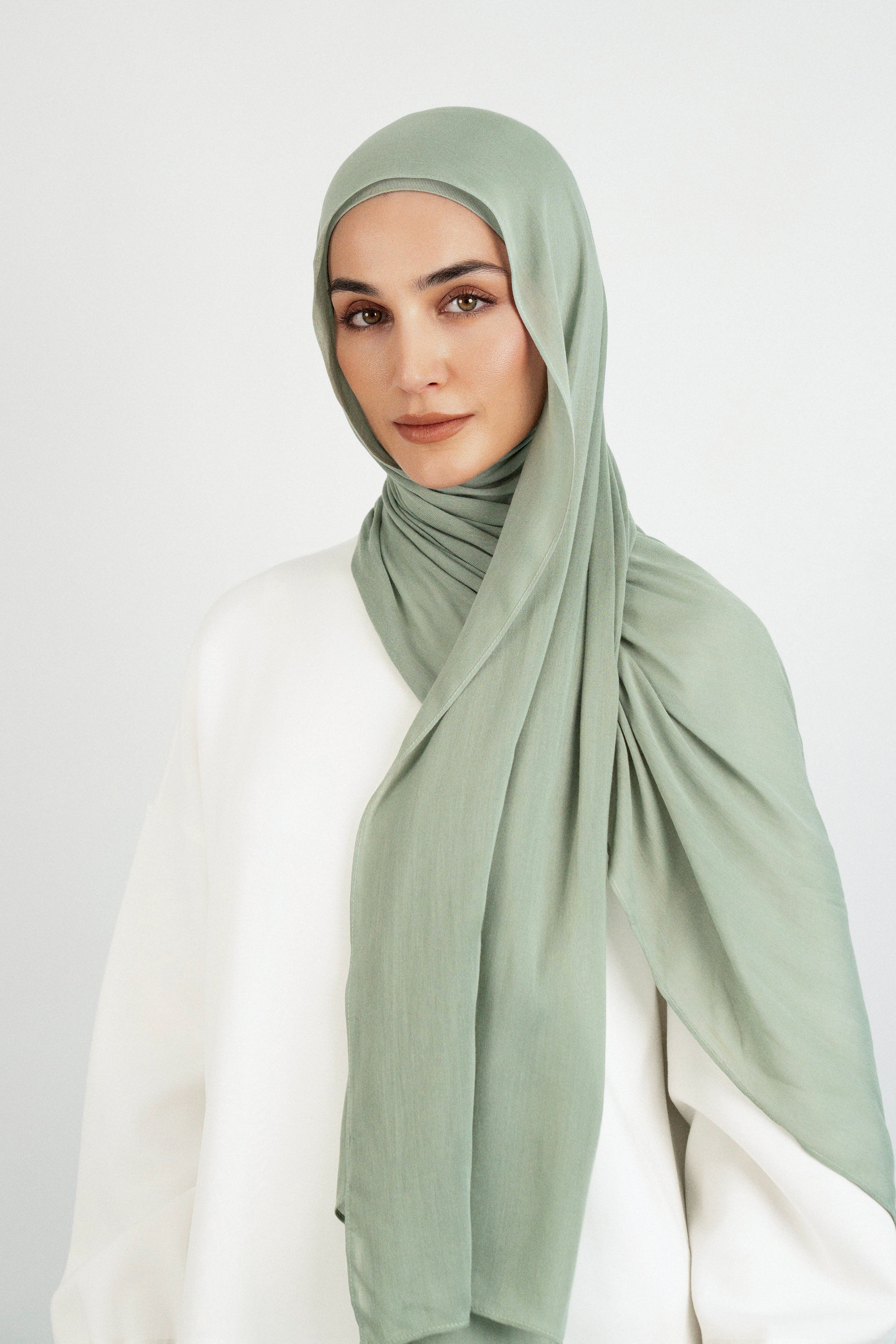 Colour: Sage. A front pose from a girl in a Matching Butter Modal Hijab Set