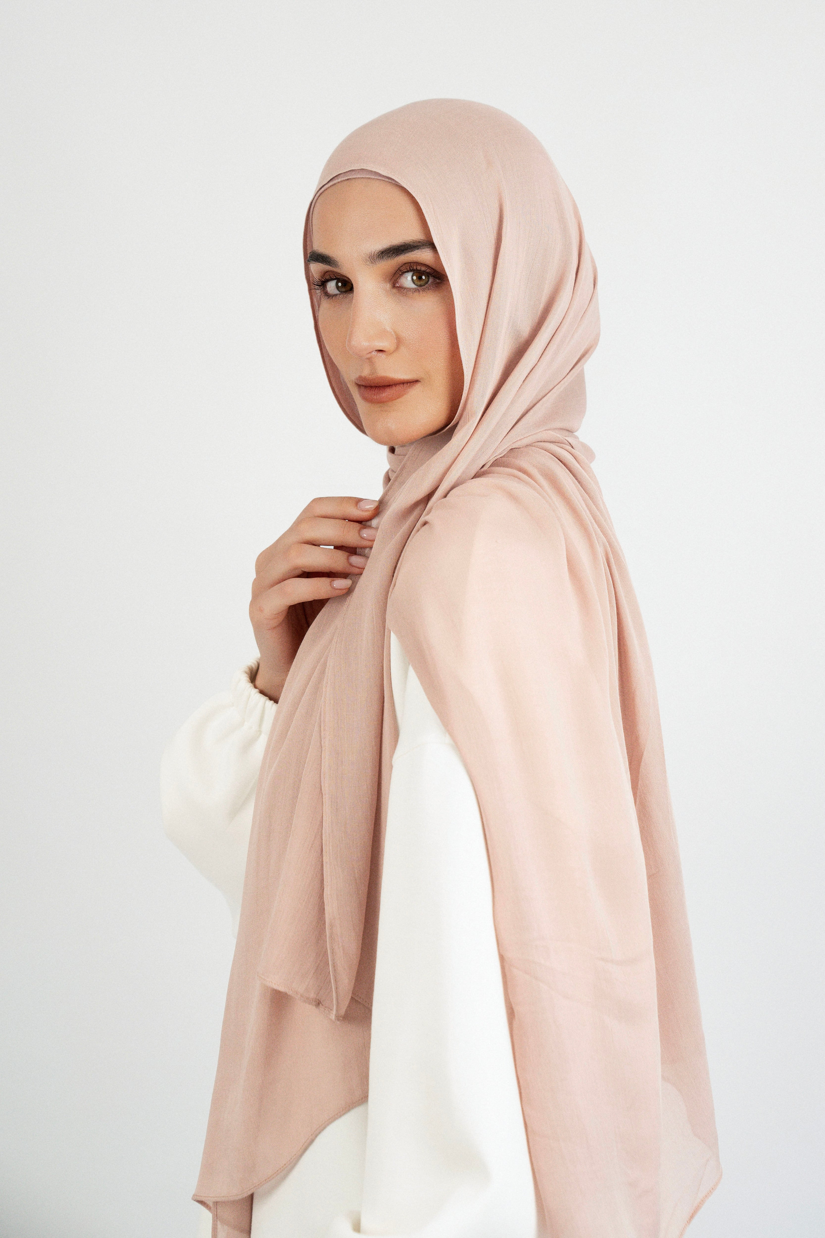 Colour: Seashell. A side pose from a model in a Matching Butter Modal Hijab Set.