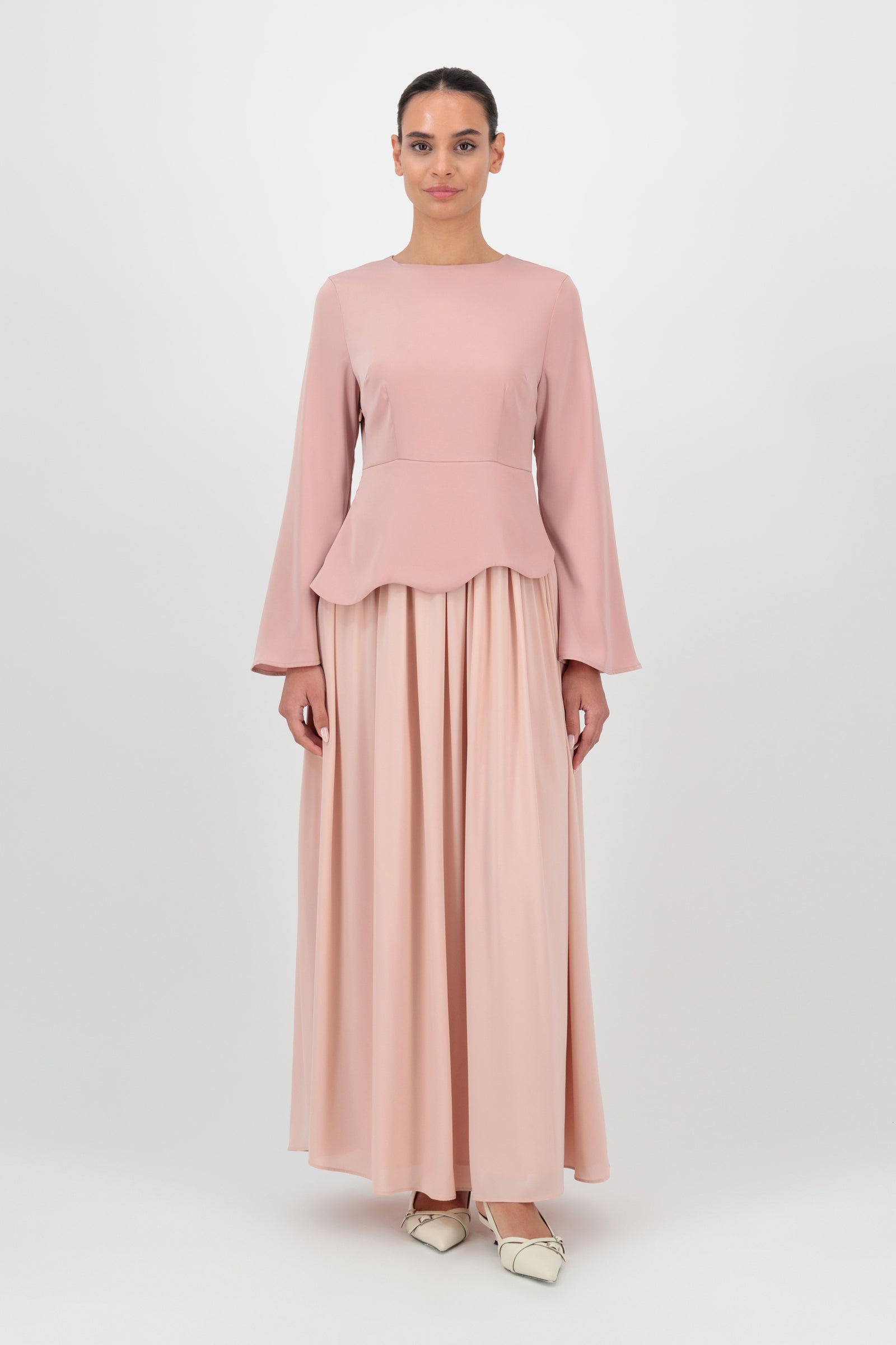 FARES Two Tone Scalloped Peplum Dress in Farawla is a soft blush peplum dress featuring a scalloped hem and flowing skirt, designed as an elegant choice for dresses for women.