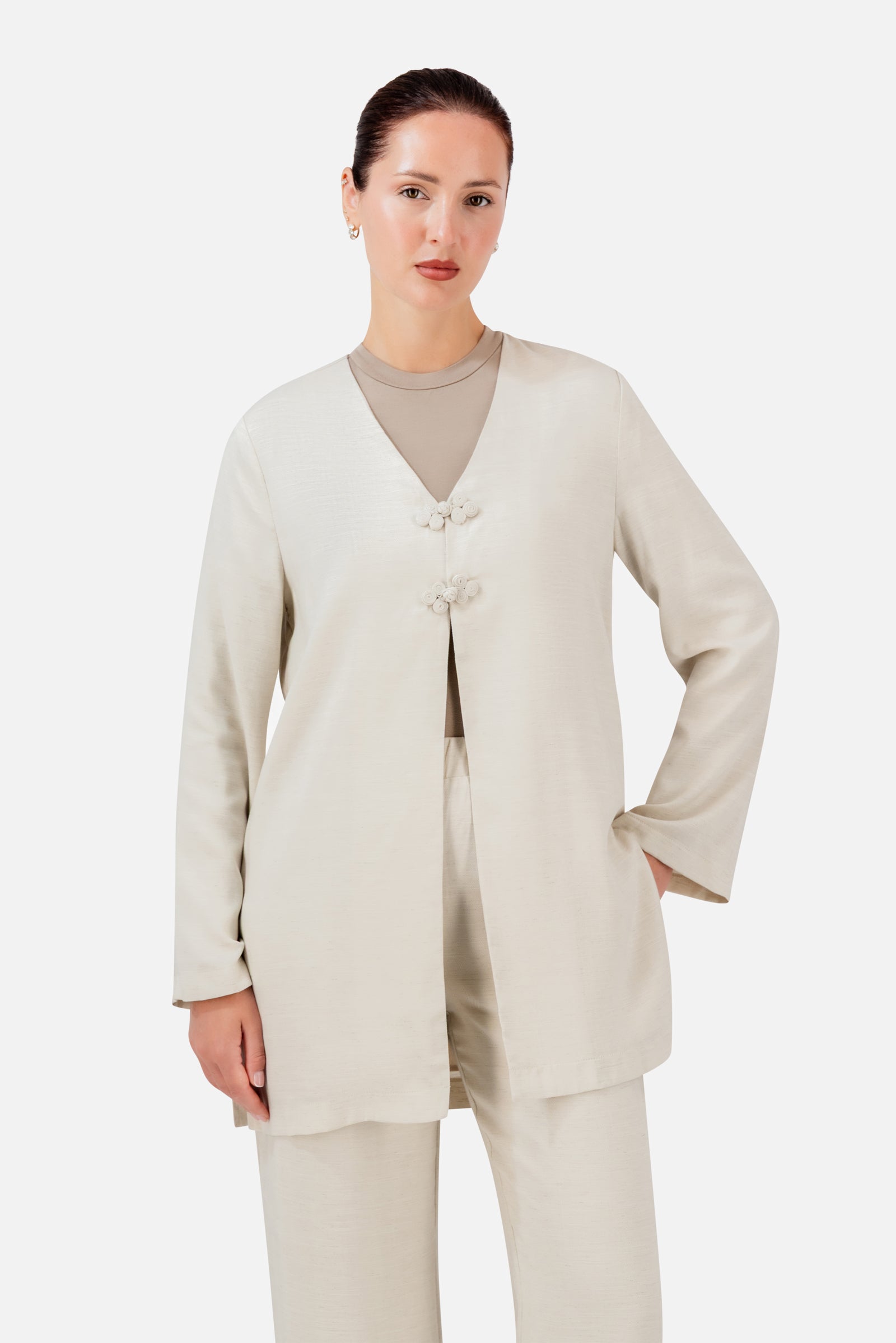 FARES Knot Detail Cardigan in Bare, a soft neutral cardigan for women with statement knot closures and a relaxed longline silhouette.