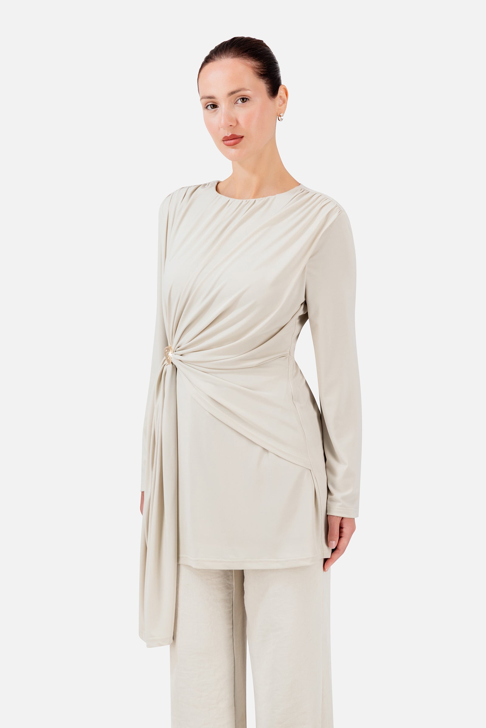 FARES Side Draped Tunic in Vanilla Cream styled with matching trousers, showcasing the asymmetric drape and elegant layered silhouette.