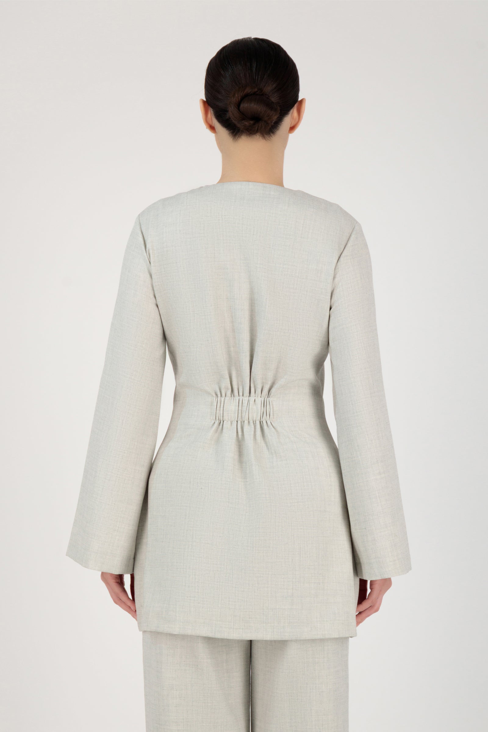 Back view of the FARES Tailored Button-Up Tunic in Chalk highlighting elegant tunic clothing with a smooth, structured fall.