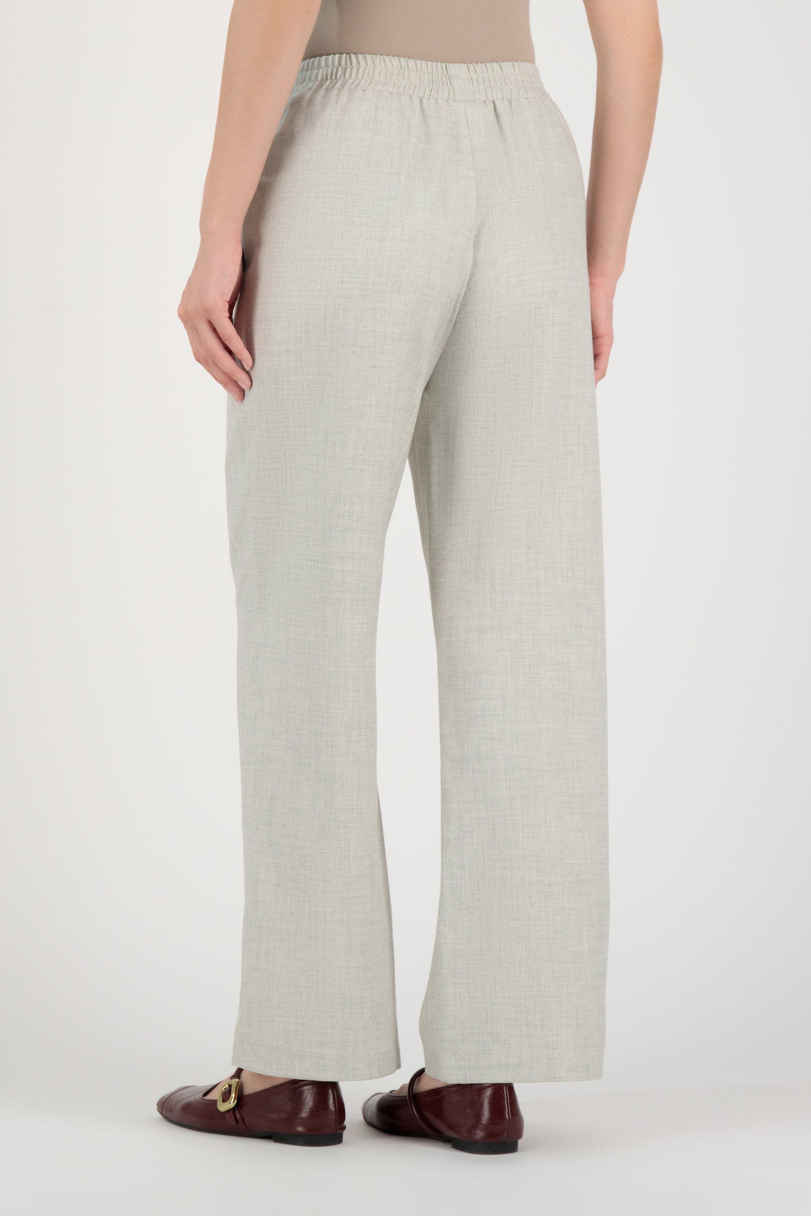 Back view of the FARES Tailored Elastic Waist Pants in Chalk highlighting smooth tailoring and the balanced structure of these elastic waist pants.
