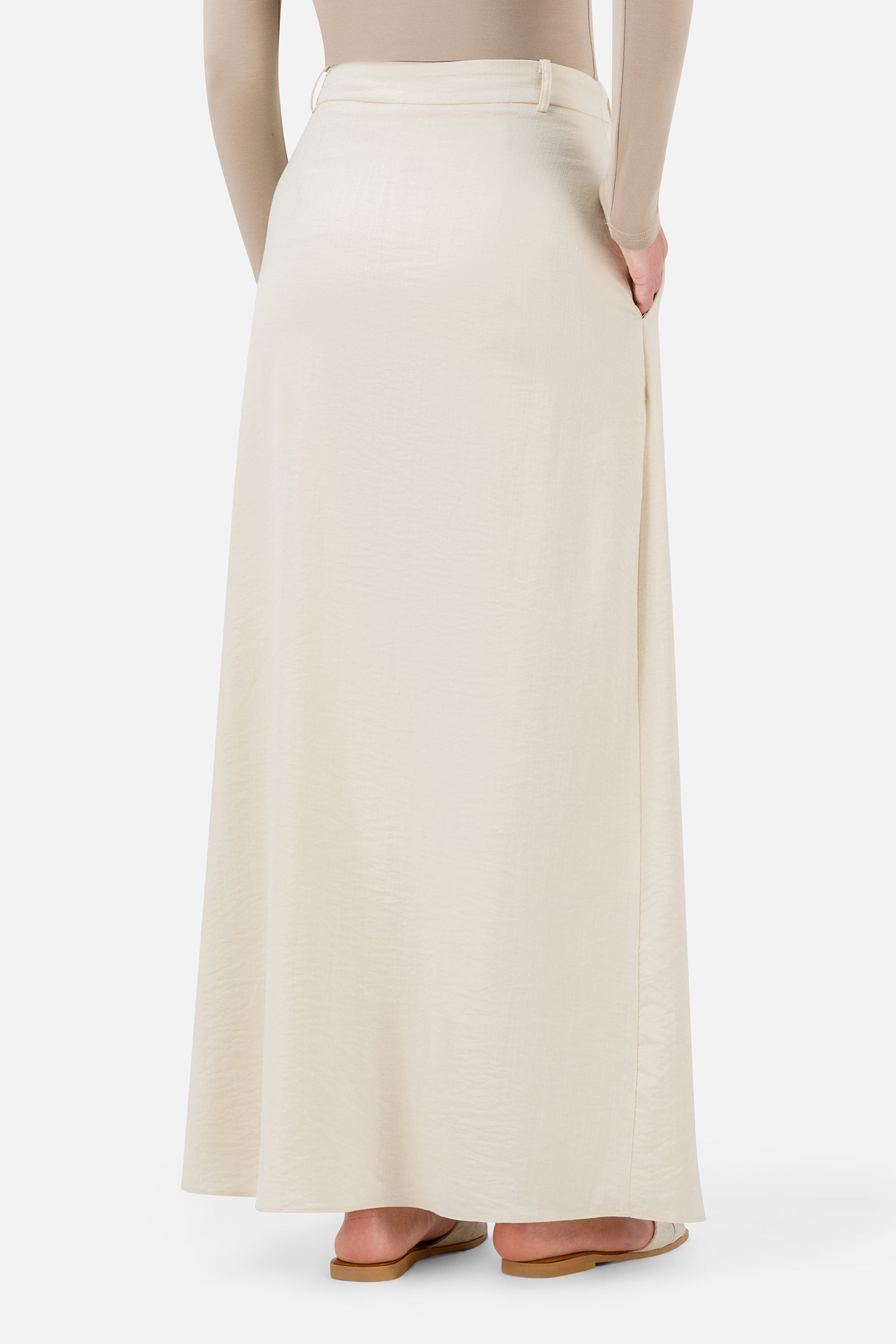 FARES Skirt Overlay Trousers in Oats shown from the back, highlighting the flowing wide-leg shape and clean waistband.