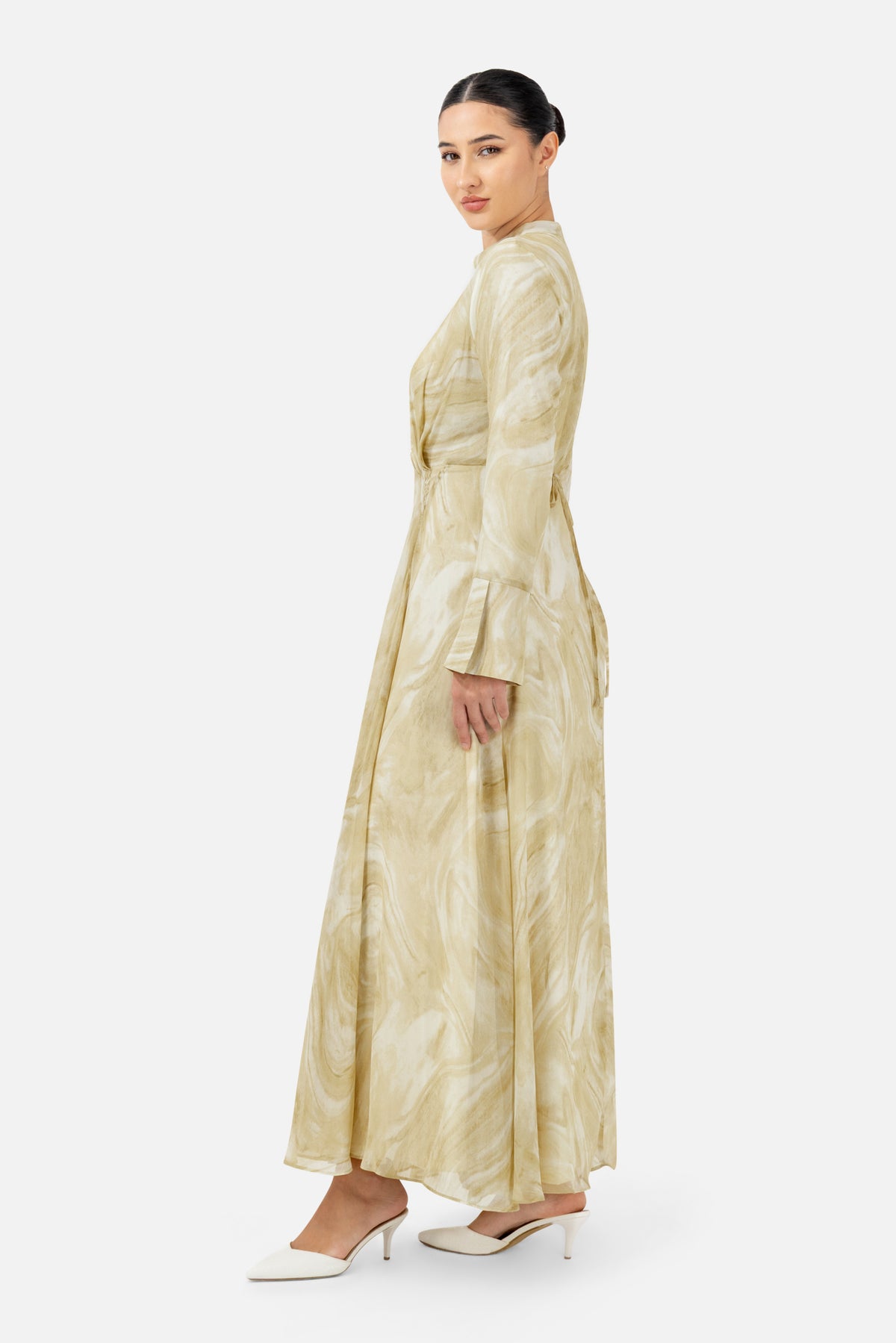 Side profile of the printed dress highlighting the relaxed fit and graceful drape.