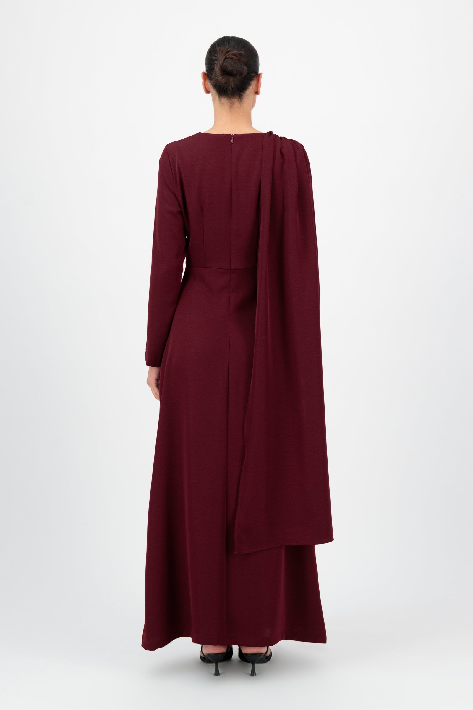 Back view of the FARES Ruched Shoulder Detail Dress in Karaz shows the graceful fall and modest length that define dresses for women.