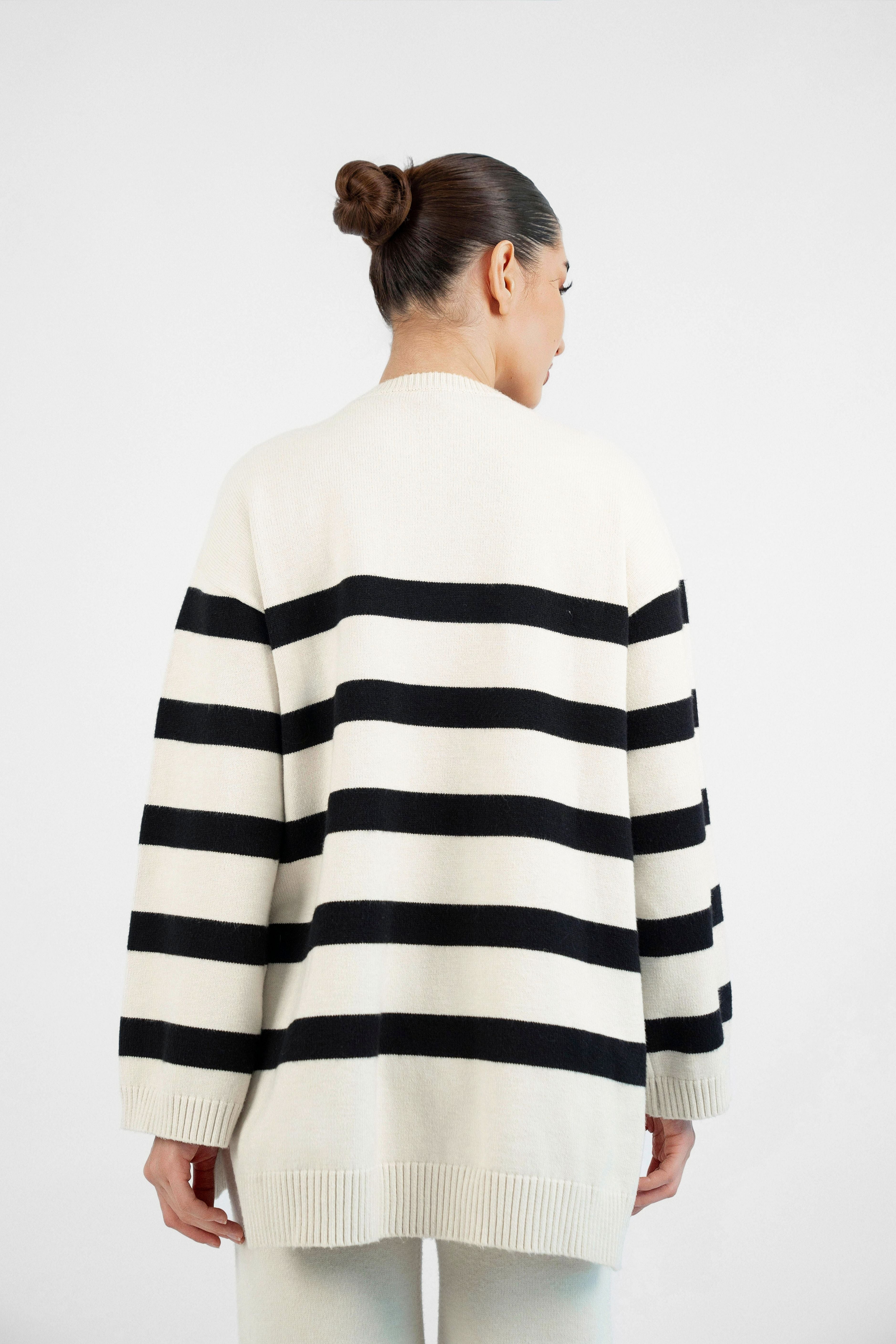 Style: Stripped. A model from behind wearing a Cloud Knit Sweater