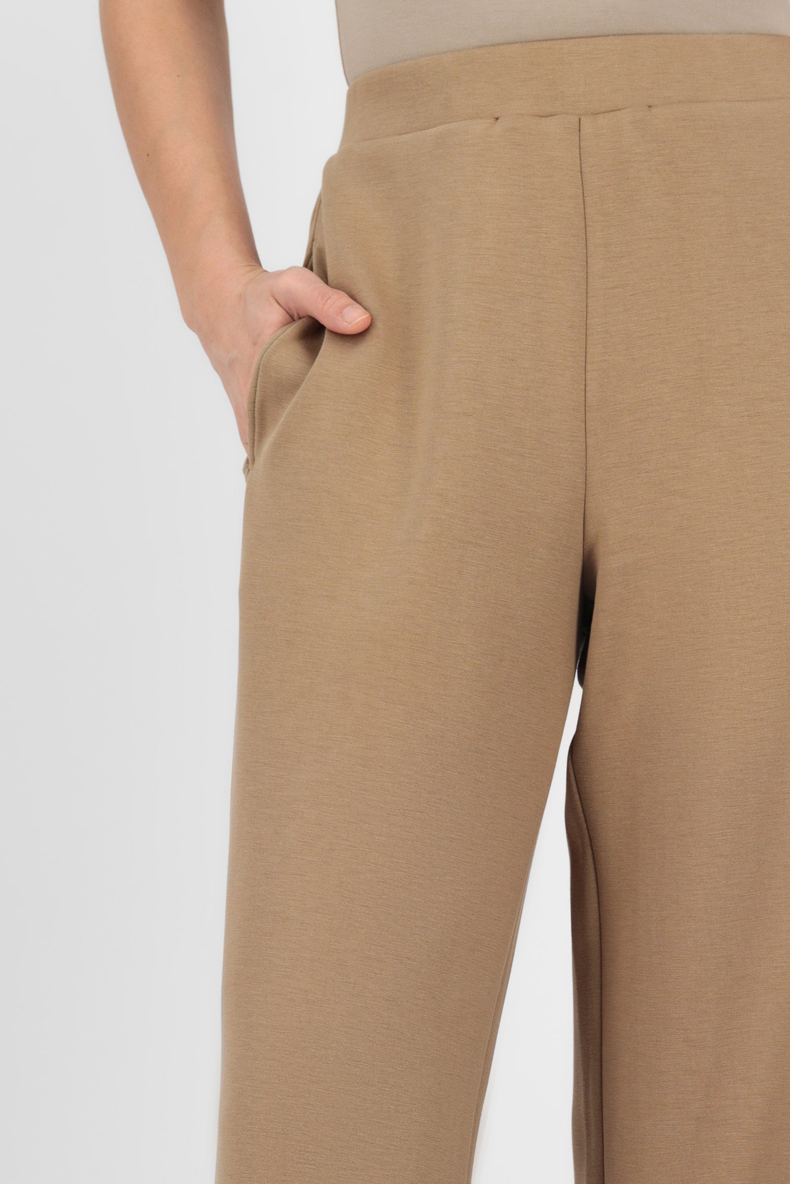Close-up of the Toffee Buttery Straight Leg Trousers showing the smooth fabric, waistband detail, and soft texture that elevate this straight leg trouser.