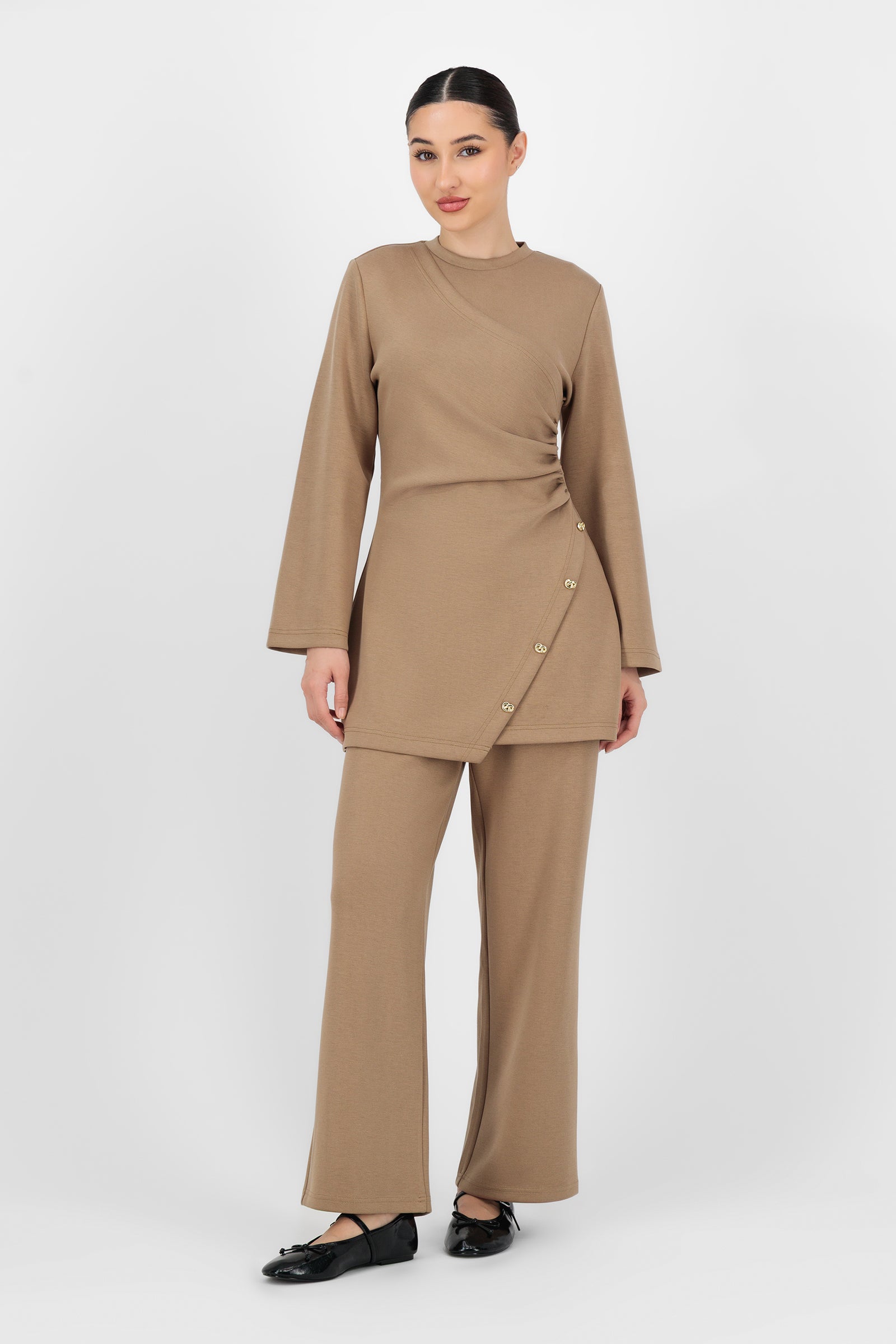 Full-body shot of the model wearing the Buttery Straight Leg Trousers Toffee, styled simply to highlight the clean, timeless shape of these trouser pants for women.