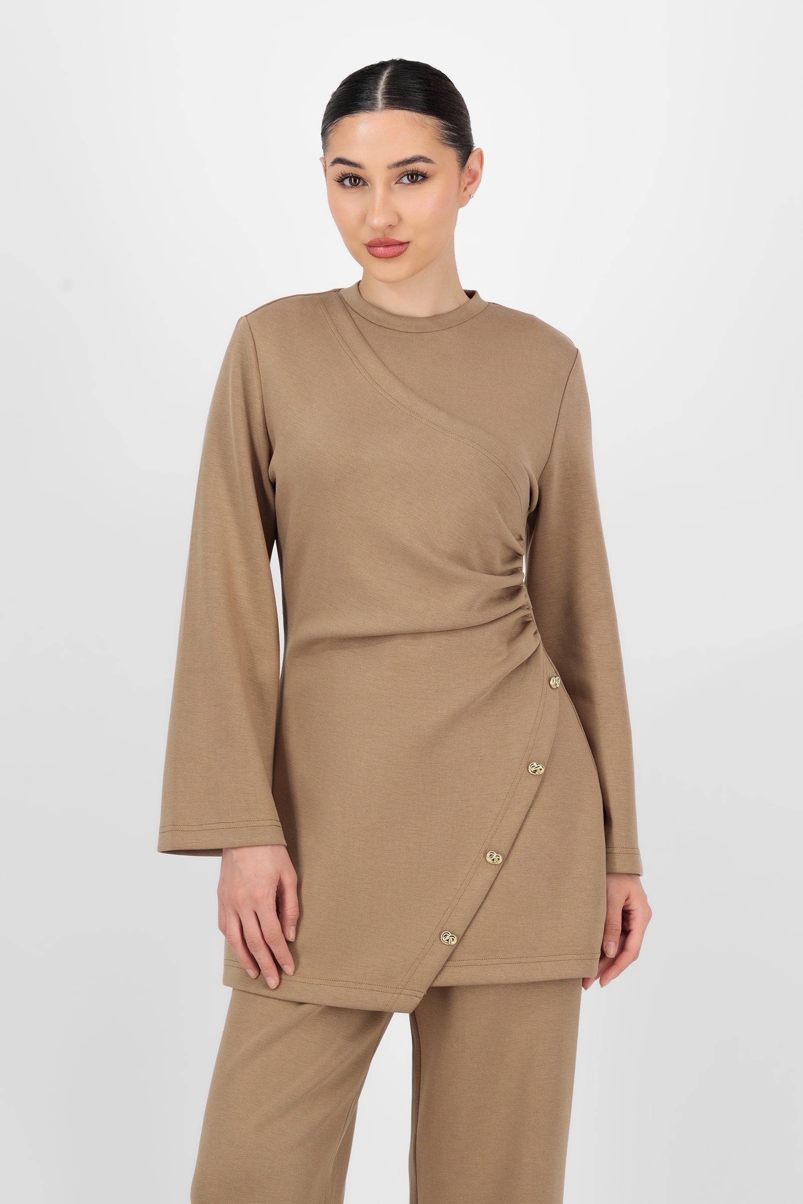 Model wearing the Buttery Side Ruched Tunic in Toffee front view, showing the soft drape and flattering shape that makes it an easy go-to for tunic clothing and everyday tunic tops.