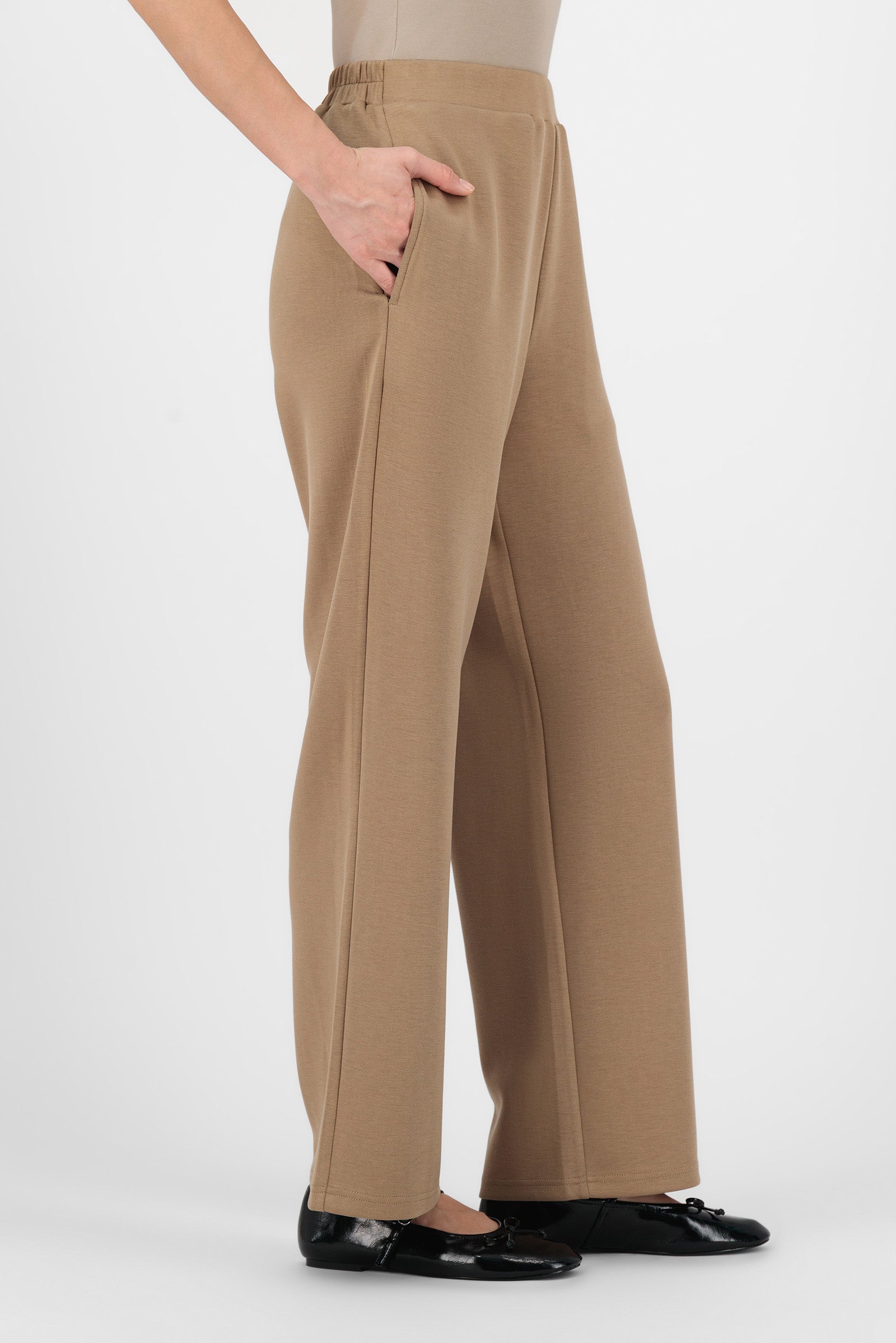 Side angle of the Toffee Buttery Straight Leg Trousers showing the soft drape and easy straight silhouette that define a comfortable, refined straight leg trouser.