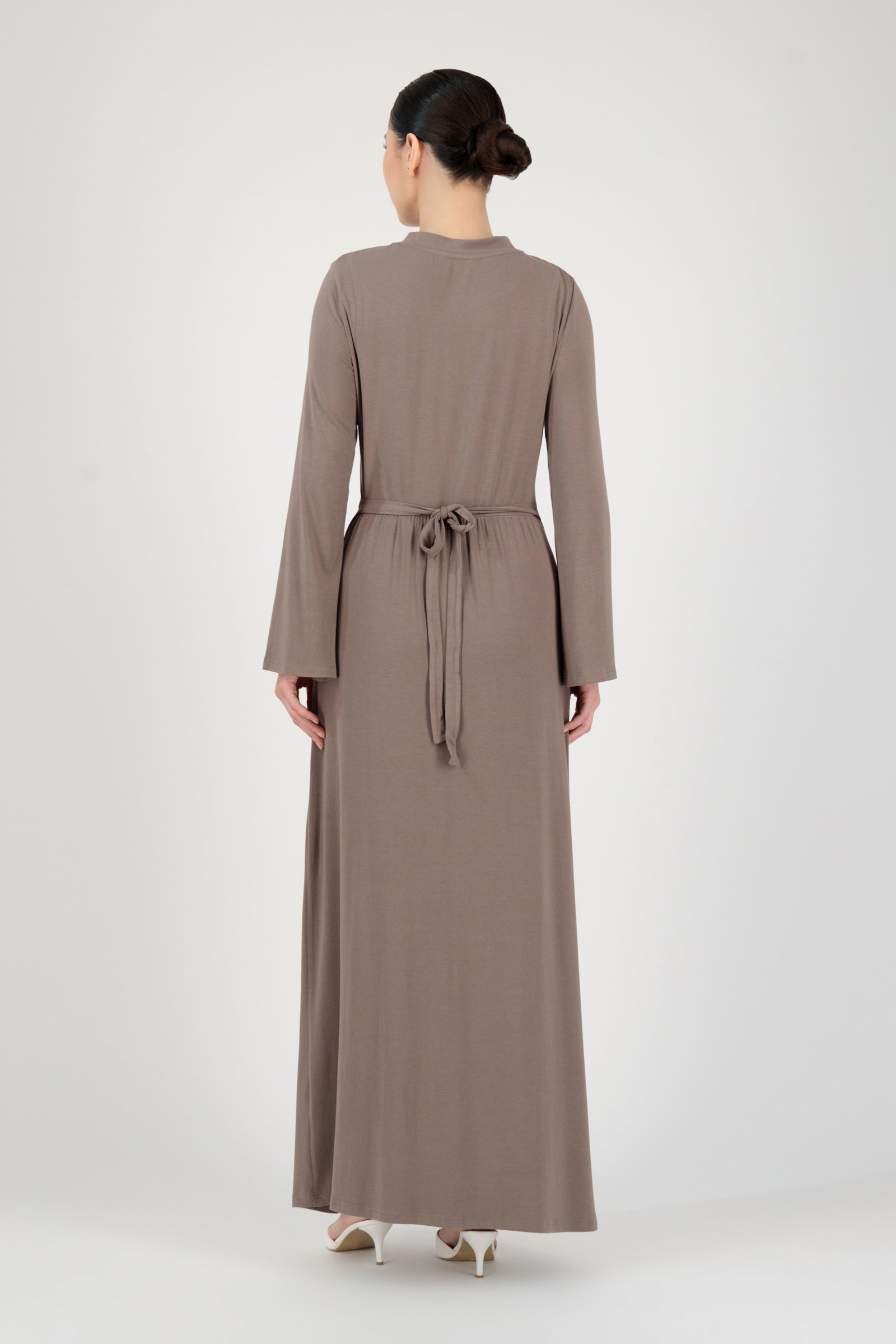 Back view of the FARES Gathered Waist Knit Dress in Pebble highlighting clean lines and the natural drape of this long sleeve dress.