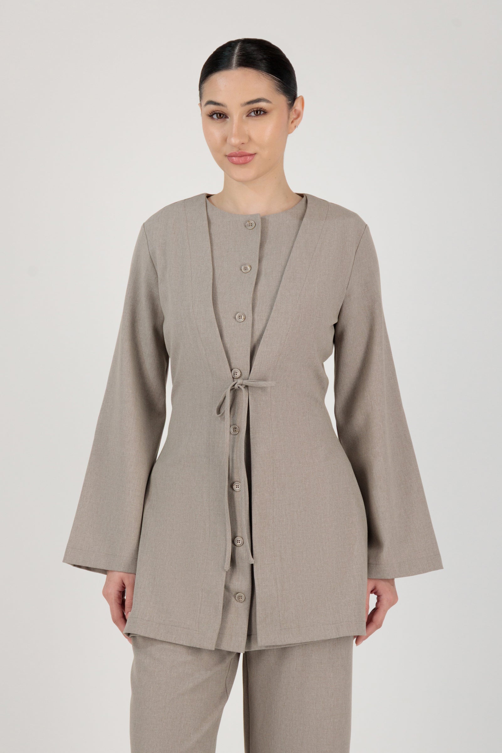 FARES Tailored Button-Up Tunic in Stone shown from the front as elegant tunic clothing with a clean button-up silhouette and modest proportions.