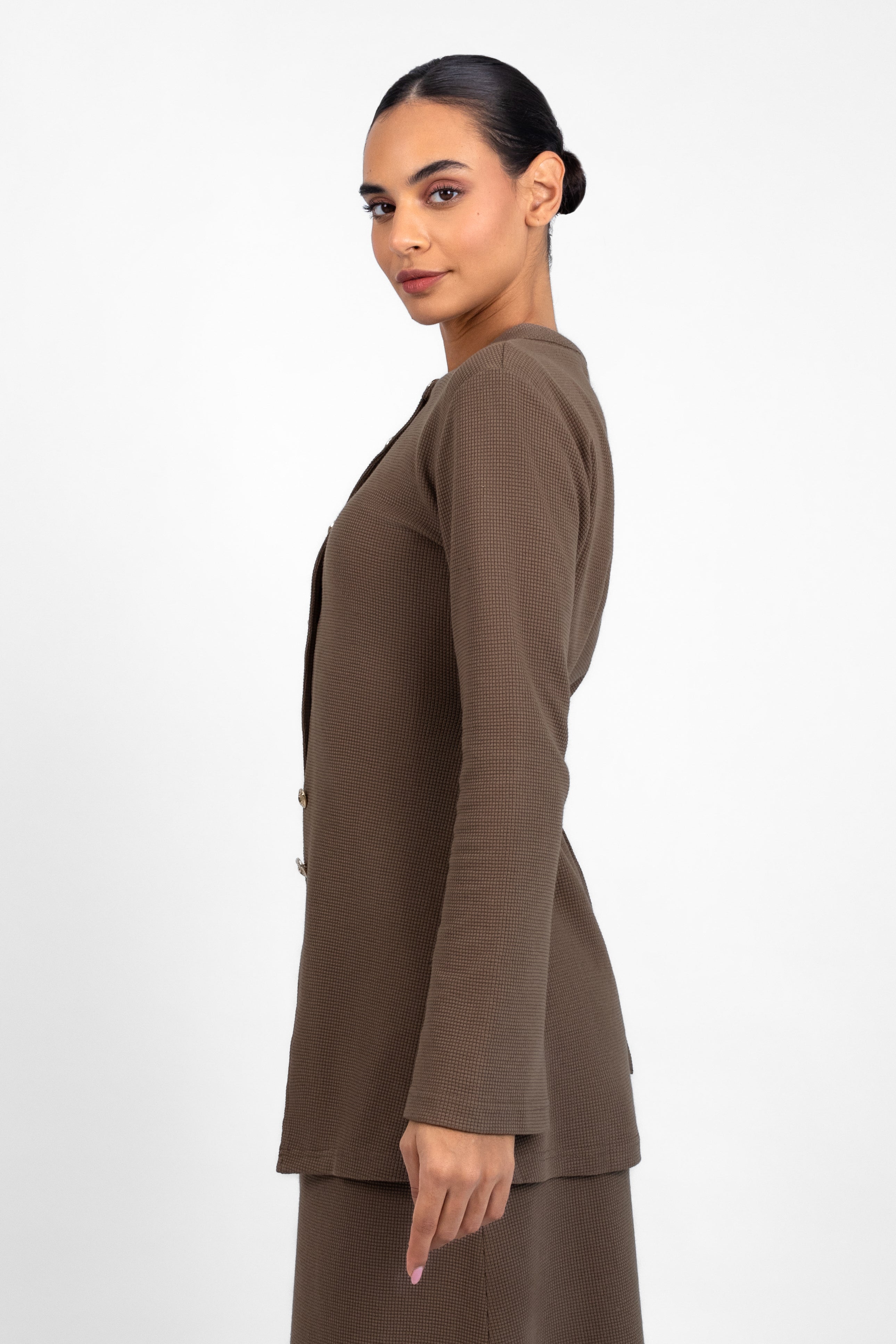 A side pose froma model in a Tailored Vintage Cardigan. Colour: Coffee