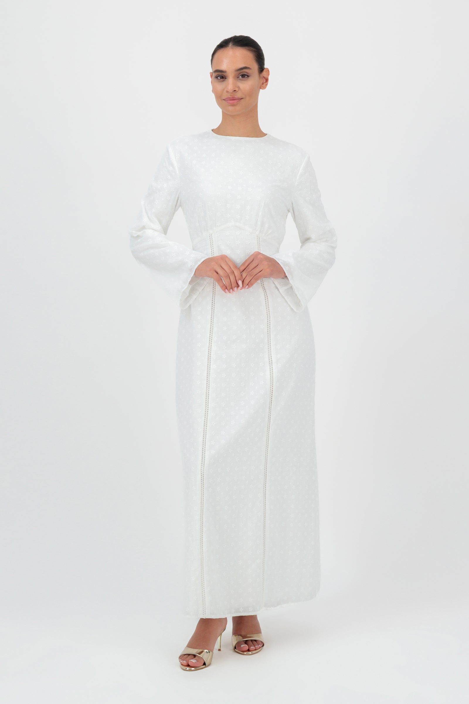 FARES Embroidered Floral Dress in White is a refined floral dress designed with delicate embroidery and a modest long silhouette for women seeking elegant floral dresses for women.