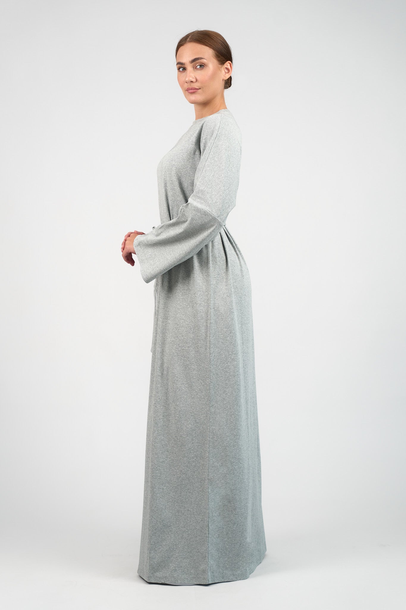 Colour: Grey Haze. A model is turned to the left in a Cotton Maxi Dress