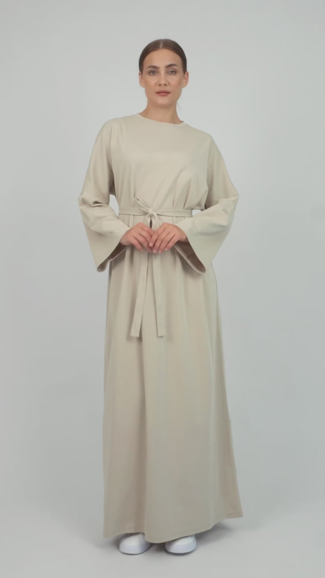 Colour: Mink. A model is showcasing the Cotton Maxi Dress from FARES.