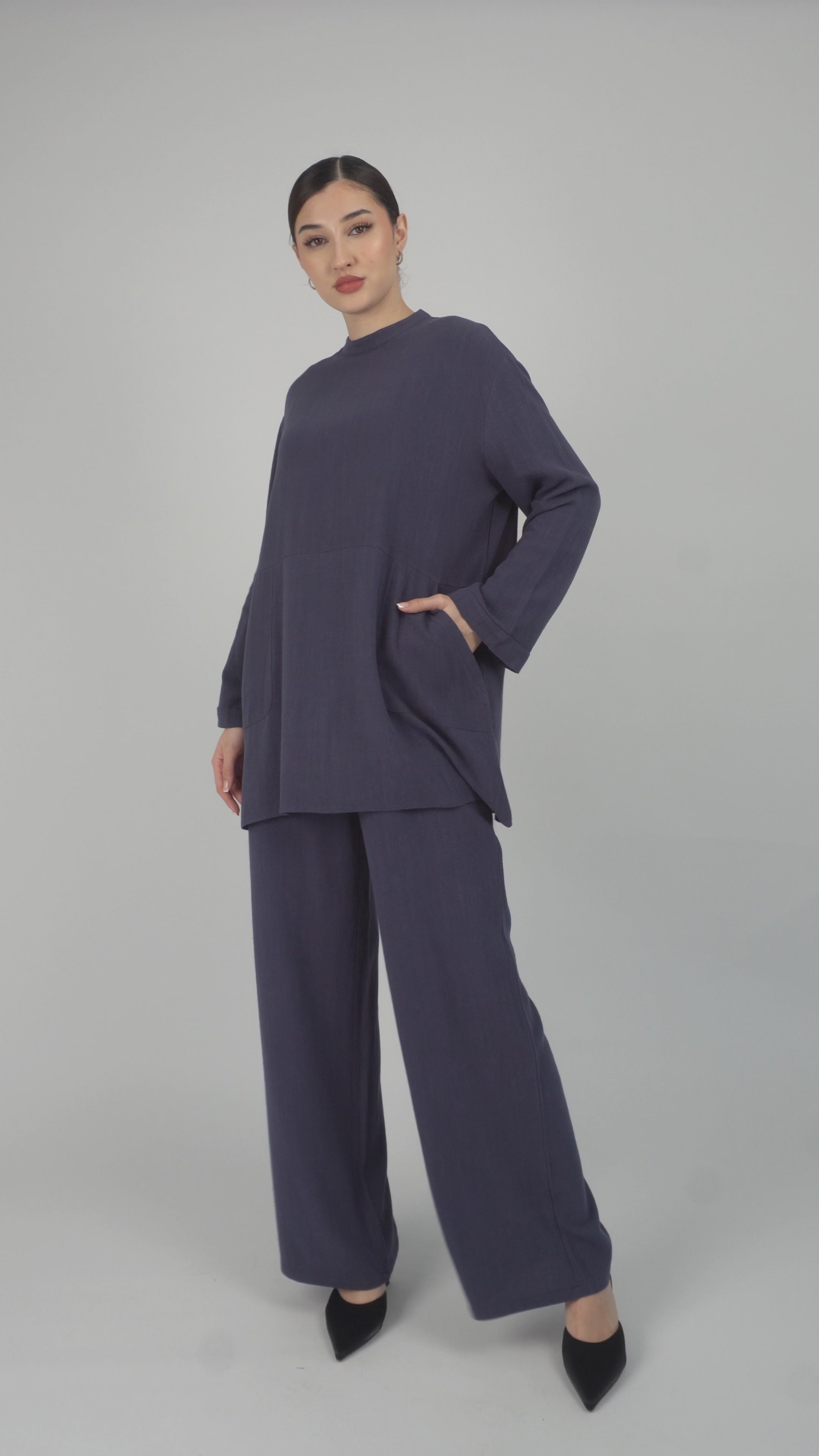 Colour: Royal Blue. A model is posing in the Linen Blend Top from FARES.