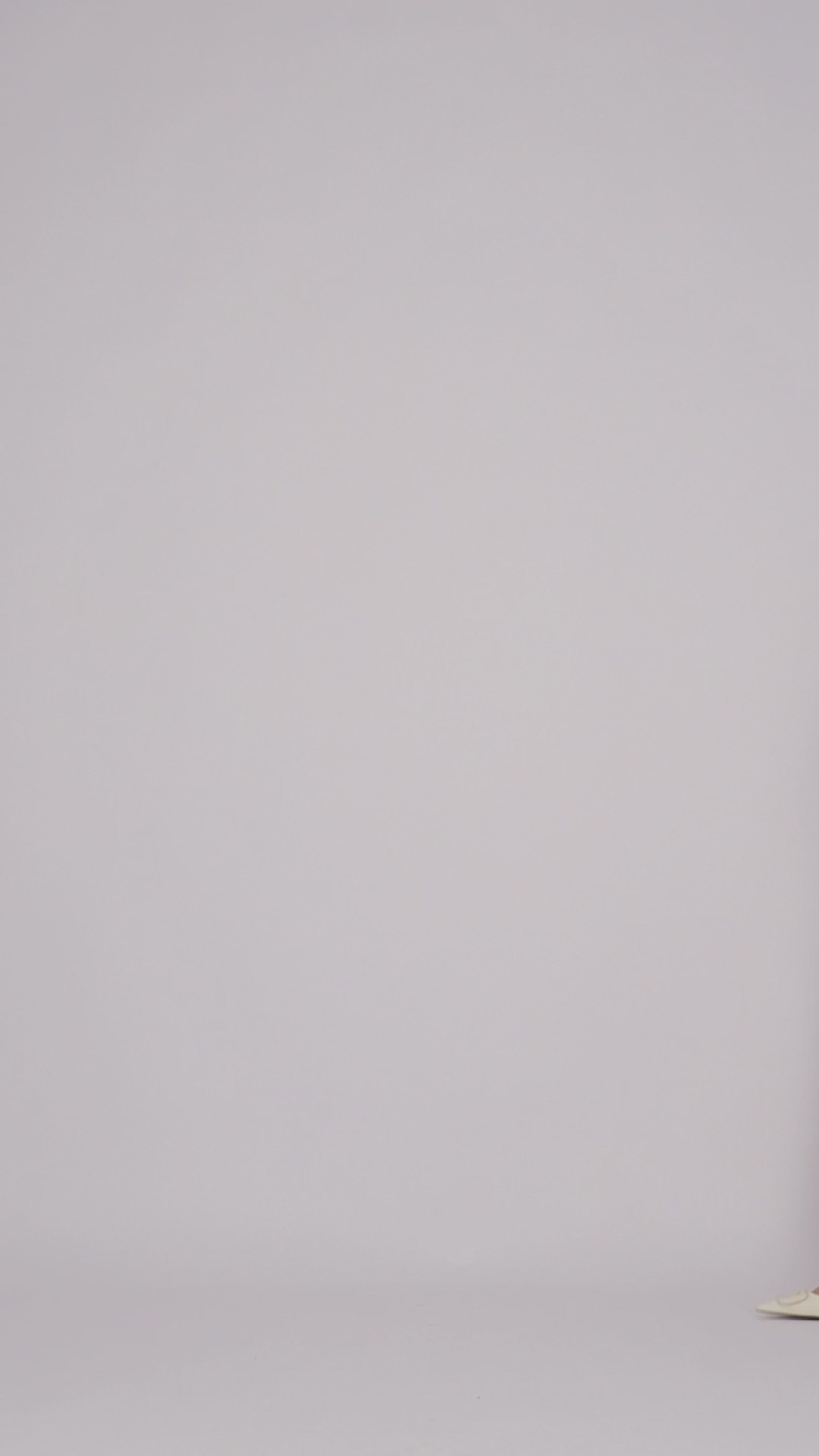 Colour: Vanilla. A model is showcasing the Linen Blend Top.