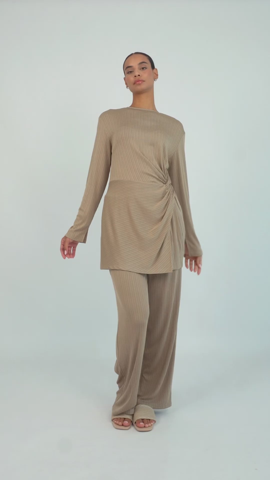 Colour: Taupe. A model is showcasing a Ribbed Side Twist Top from FARES.