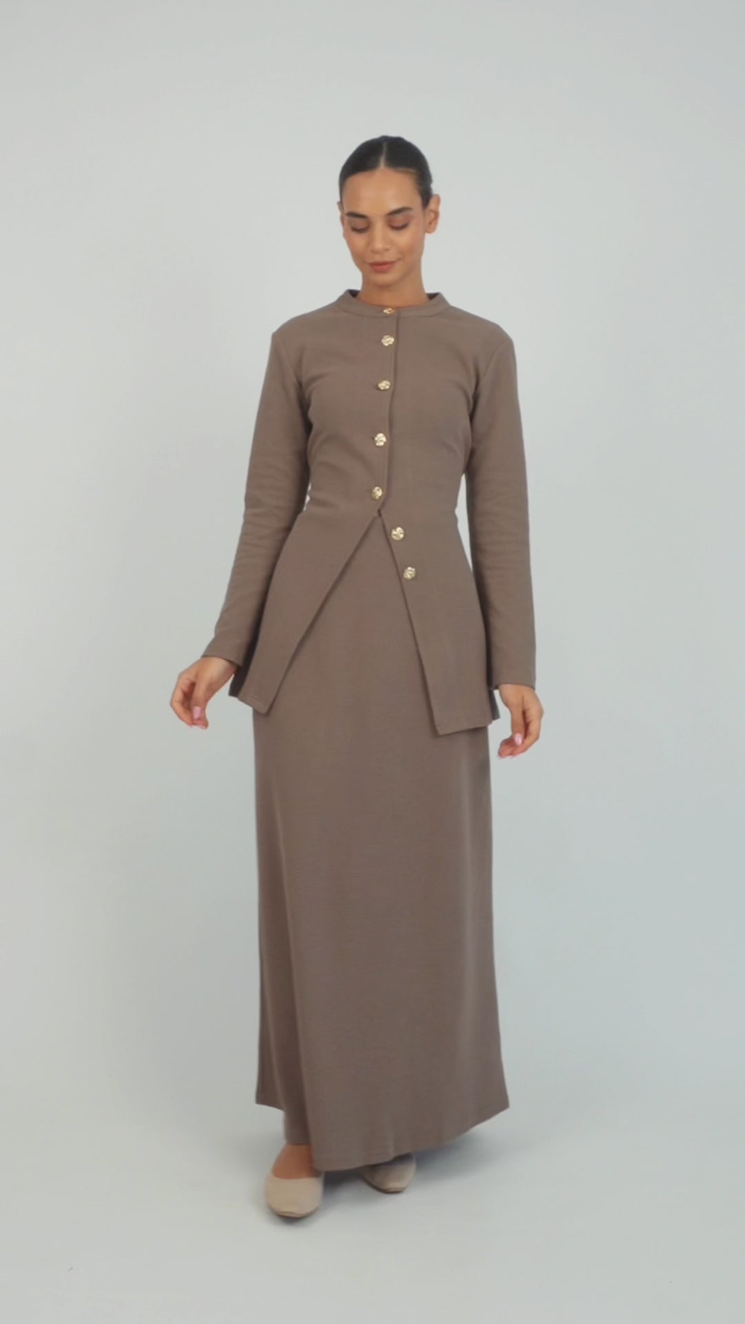 A model is showing poses in a Tailored Vintage Cardigan. Colour: Coffee