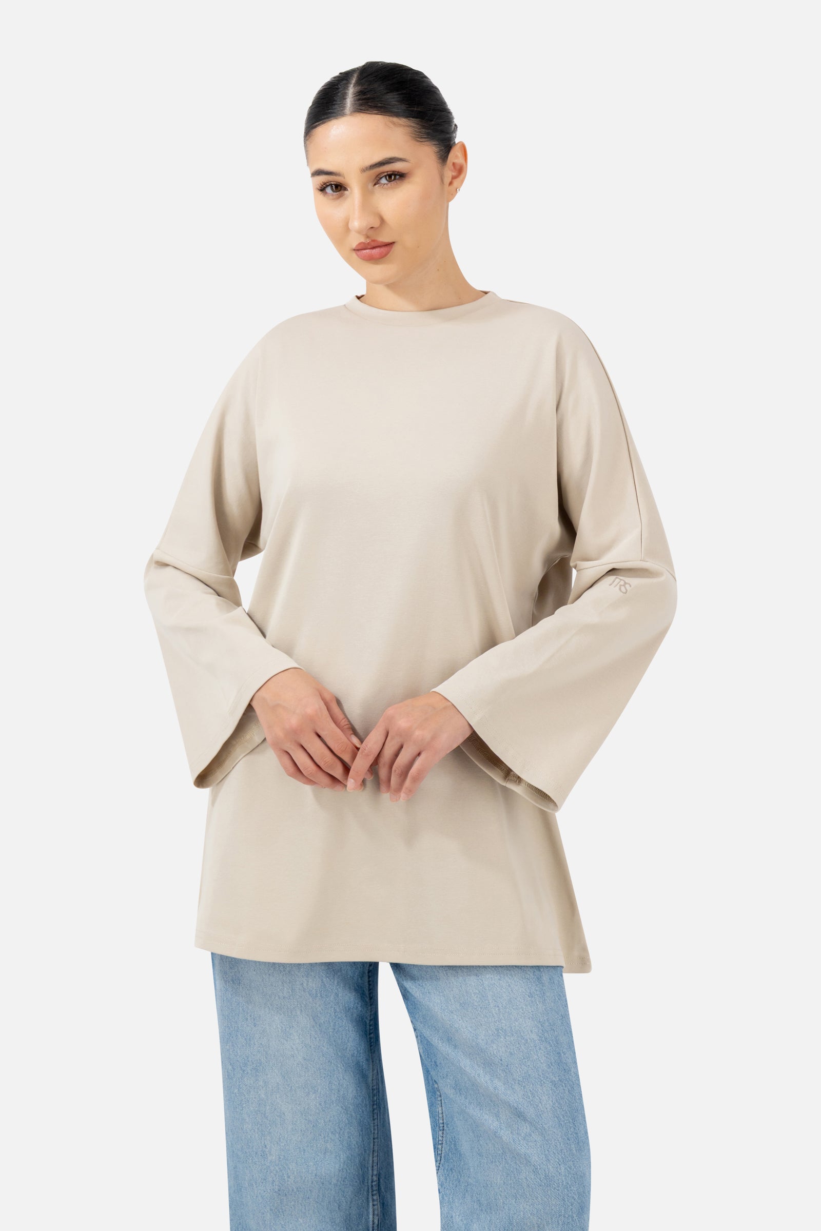 Front view of the Mink Cotton Long-Sleeve Tee with an oversized fit and relaxed silhouette.